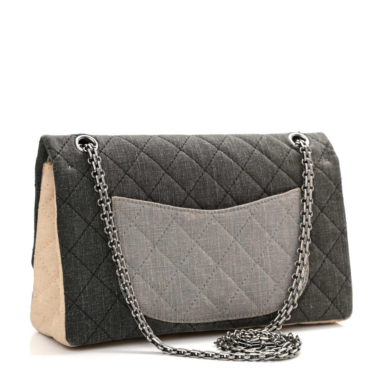 Chanel Multi color small canvas denim quilted flap with reissue turnlock hardware and classic reissue chain

Year: 2009 {VINTAGE 13 Years}
Silver hardware
Classic back pocket
Interior flap with snap closure
Large zippered pocket on flap
Three