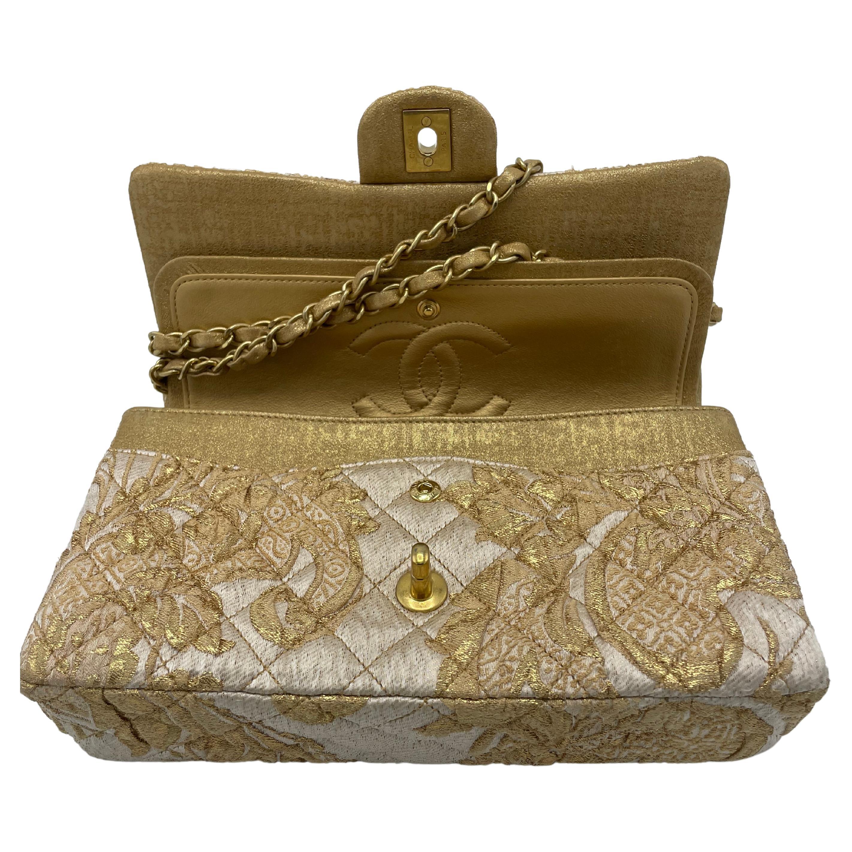 Chanel 2.55 Medium Flap Bag Gold Canvas. In pristine condition. Limited edition. A floral beige and gold bag design with gold hardware and a chain-link shoulder strap, a back patch pocket, and a classic gold CC turnlock on the crossover