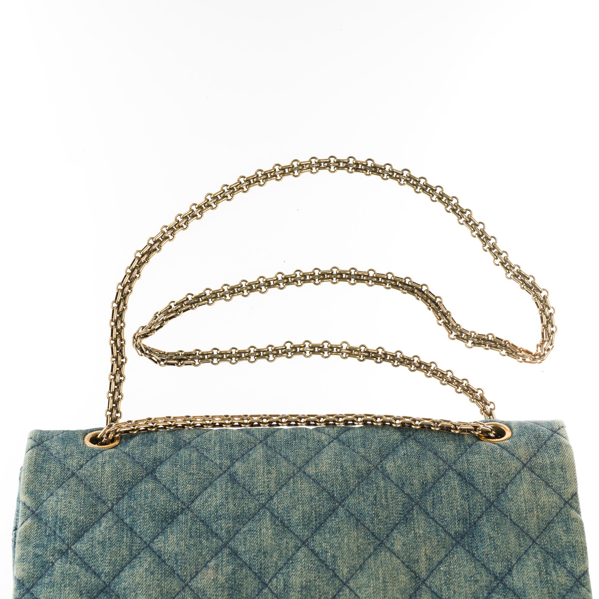 Women's Chanel 2.55 Reissue 227 handbag in blue quilted denim with bronze hardware
