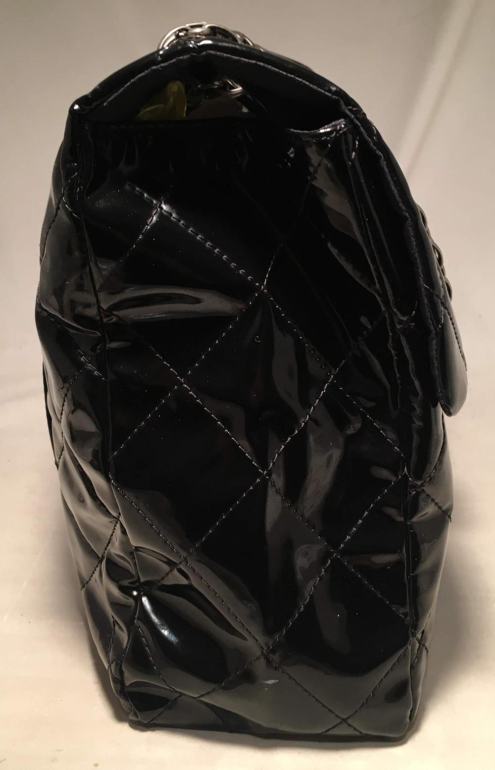 CHANEL black PVC XXL classic shoulder bag tote. Black quilted PVC exterior with gunmetal hardware. Mademoiselle style front closure opens single flap style to a black nylon lined interior that holds 1 zippered, 1 slit, and 1 cell phone pocket and