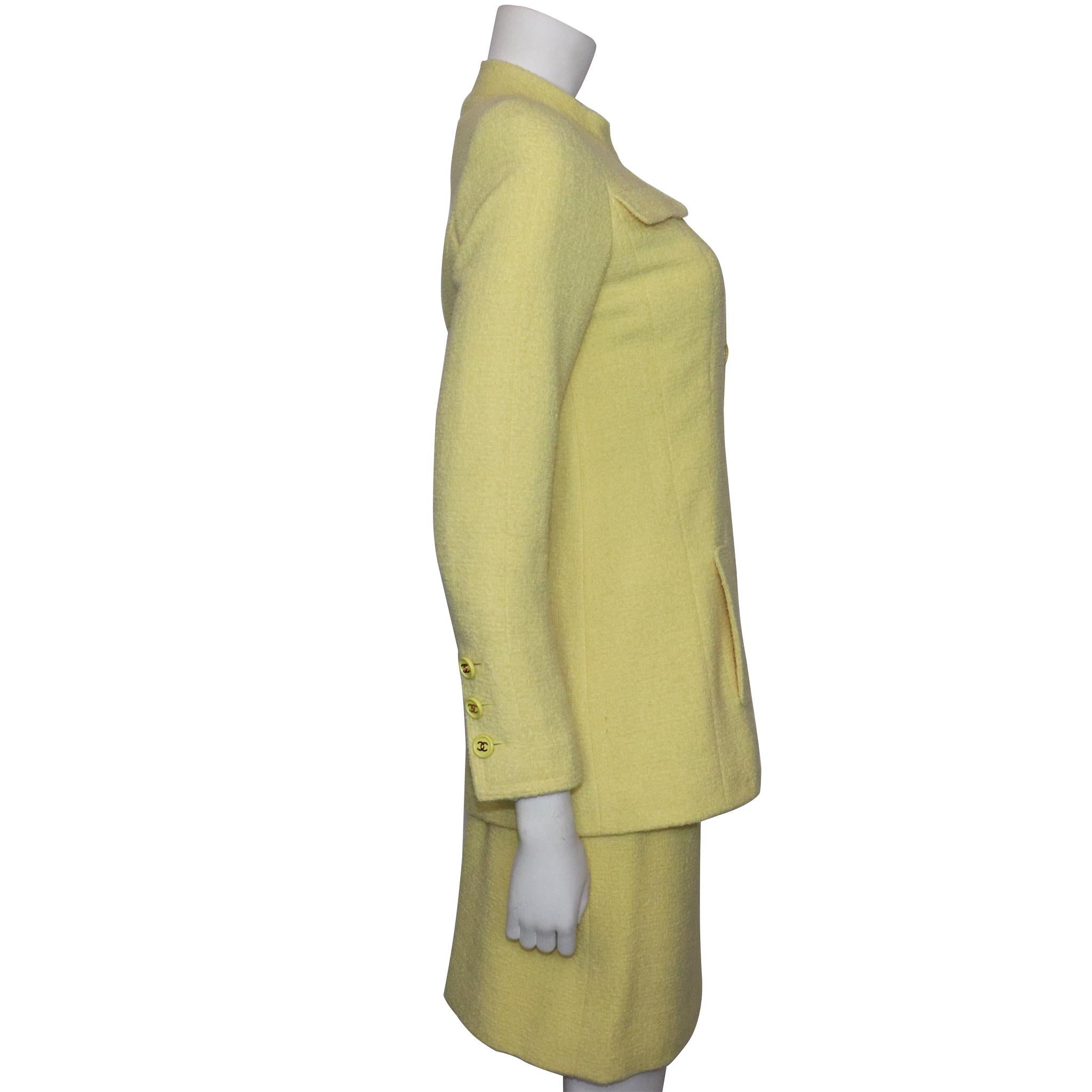 Chanel 2PC Yellow Skirt Suit w/  Mandarin Collar Circa 1990s. In excellent condition 
Fabric: Laine Wool 
Measurements-

Size 36 
Bust: 36 Inches
Waist: 28 Inches
Hip: 36 Inches
Arm Length: 23 Inches
Jacket Length: 28 Inches
Skirt Length: 20 Inches