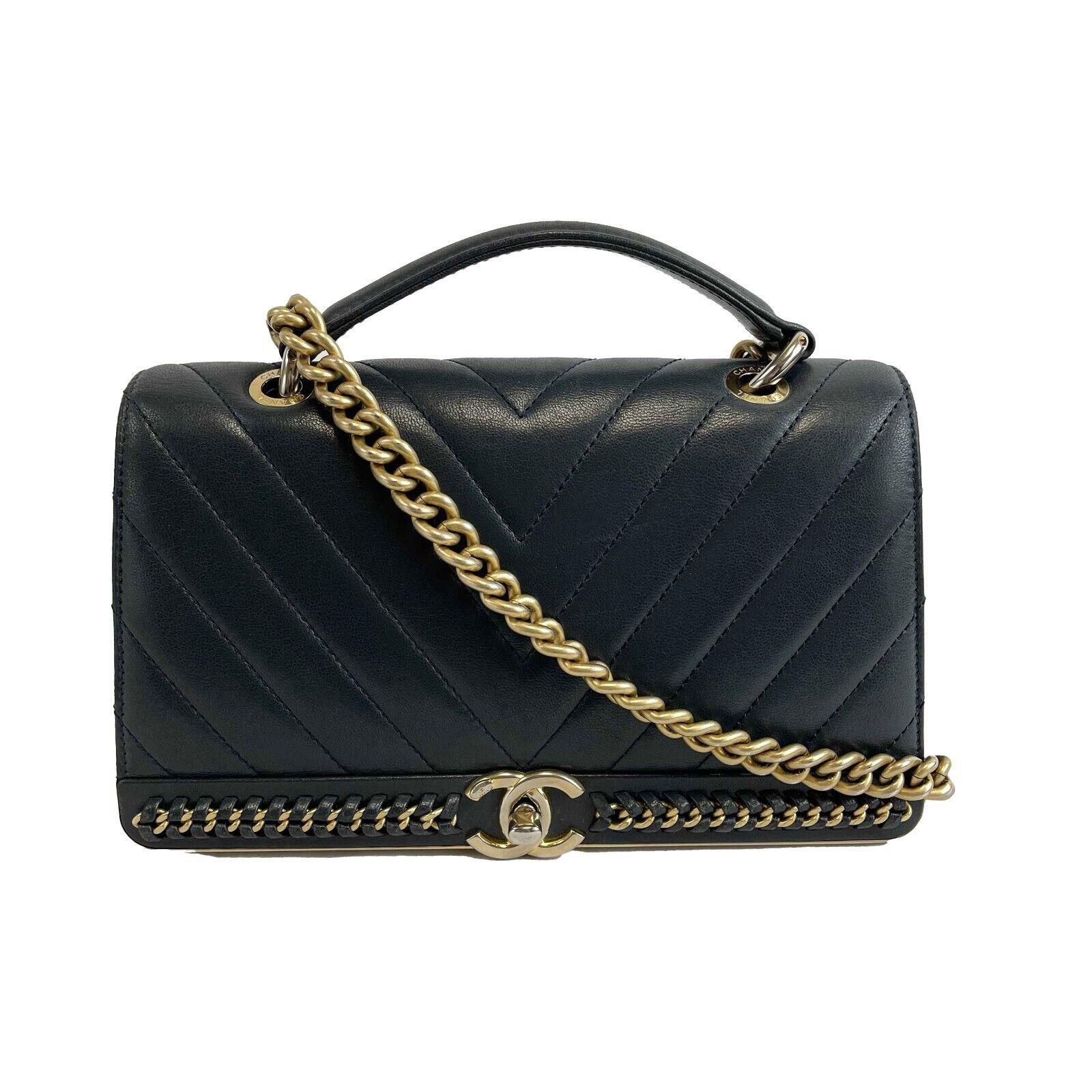 CHANEL - 2Way Bag V Stitch CC Coco Mark Black Leather Top Handle Crossbody
Description

Chevron stitched
Leather and aged gold chain detail on front
Leather top handle
Shoulder chain with a leather shoulder pad
Aged gold Chanel CC turn lock
Exterior