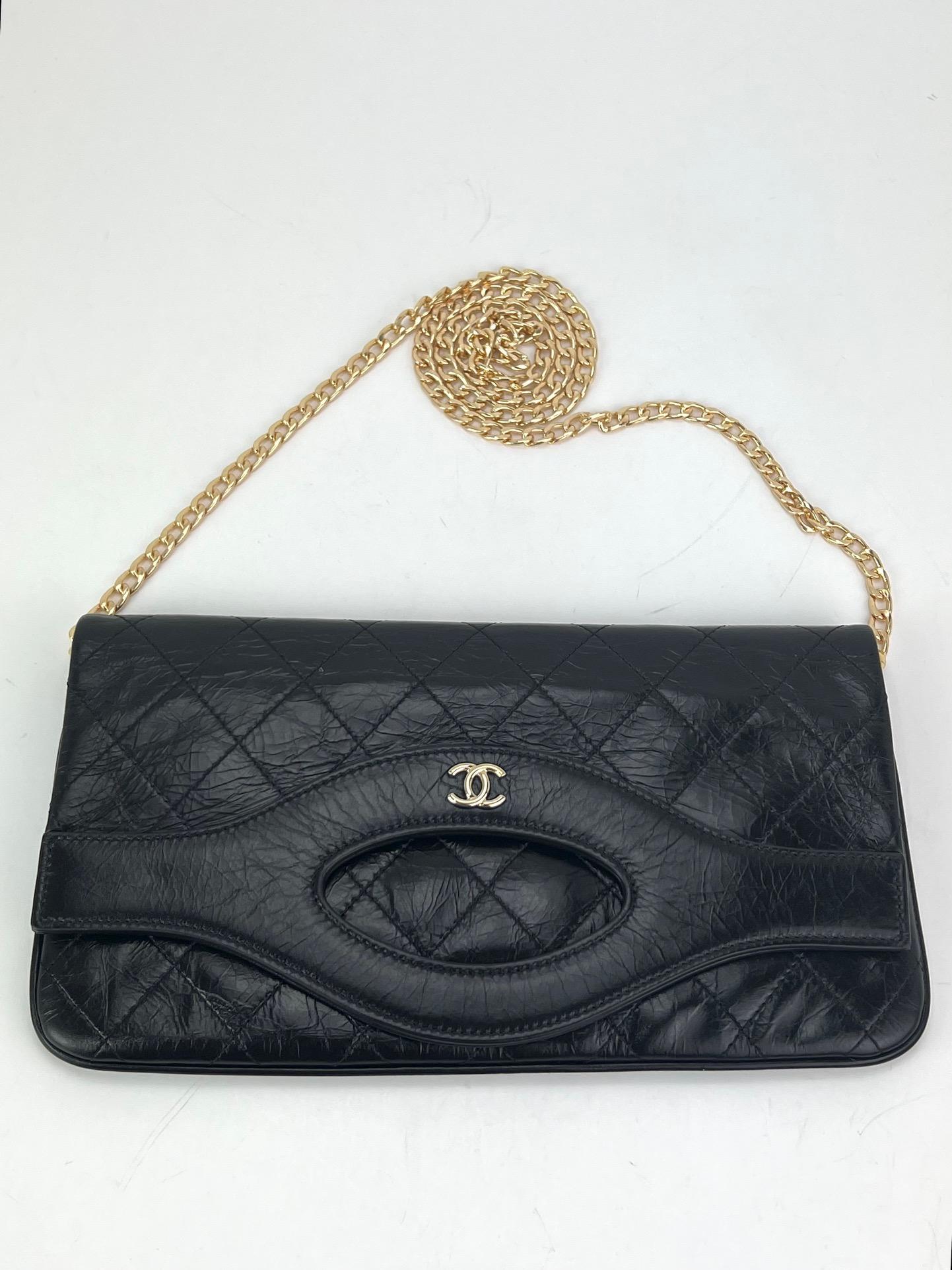Pre-Owned  100% Authentic
CHANEL 31 Pouch Shiny Crumpled calfskin Small Clutch
RATING: A...excellent, near mint, only slight
signs of wear
MATERIAL: calfskin
STRAP: added non Chanel golden chain 47'' long
attaches to Zipper pull and lays under