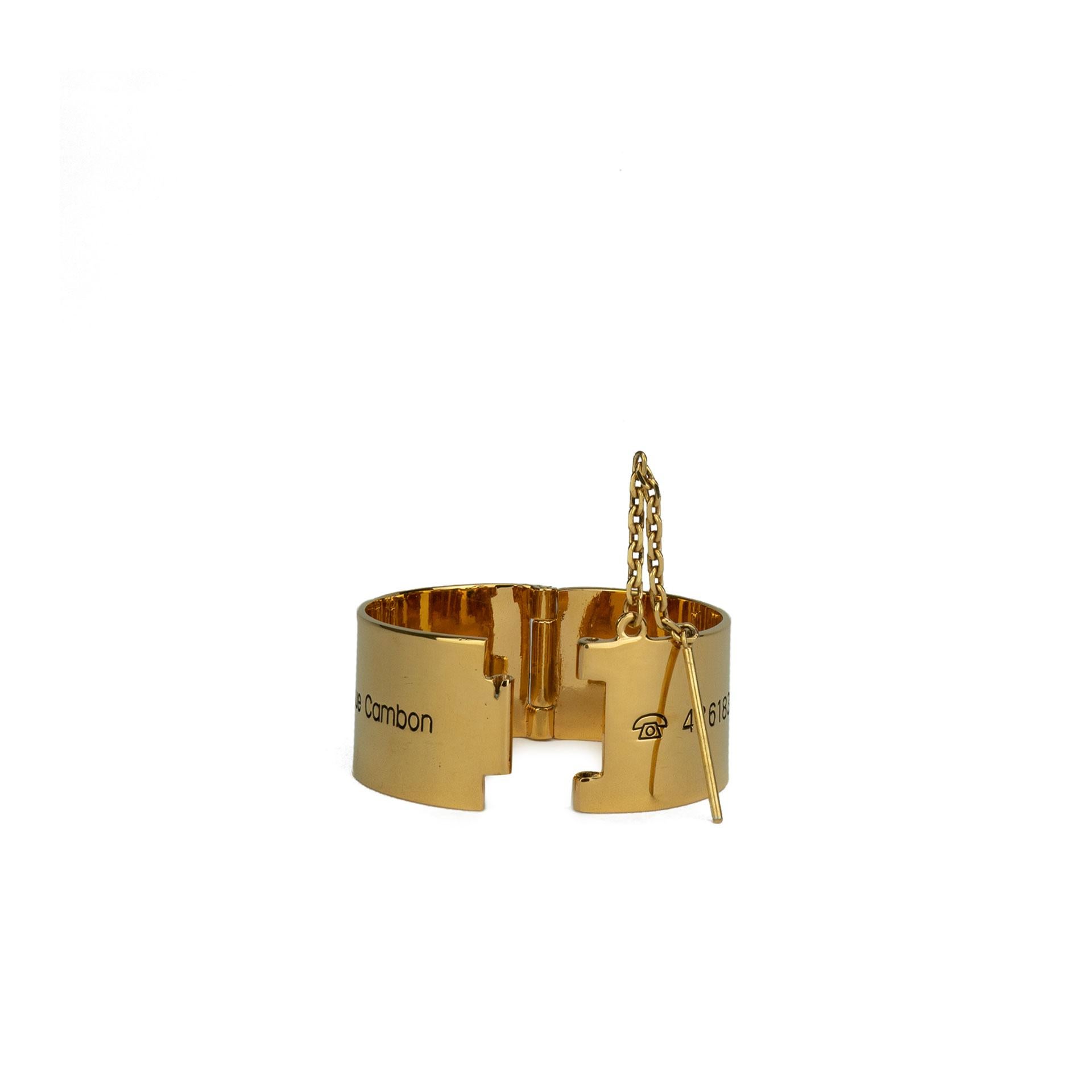 Chanel 31 Rue Cambon Cuff

Circa 1990s {VINTAGE 20 Years}
Gold plated 
31 Rue Cambon Address & Telex Engraved 
Pin closure
7.75