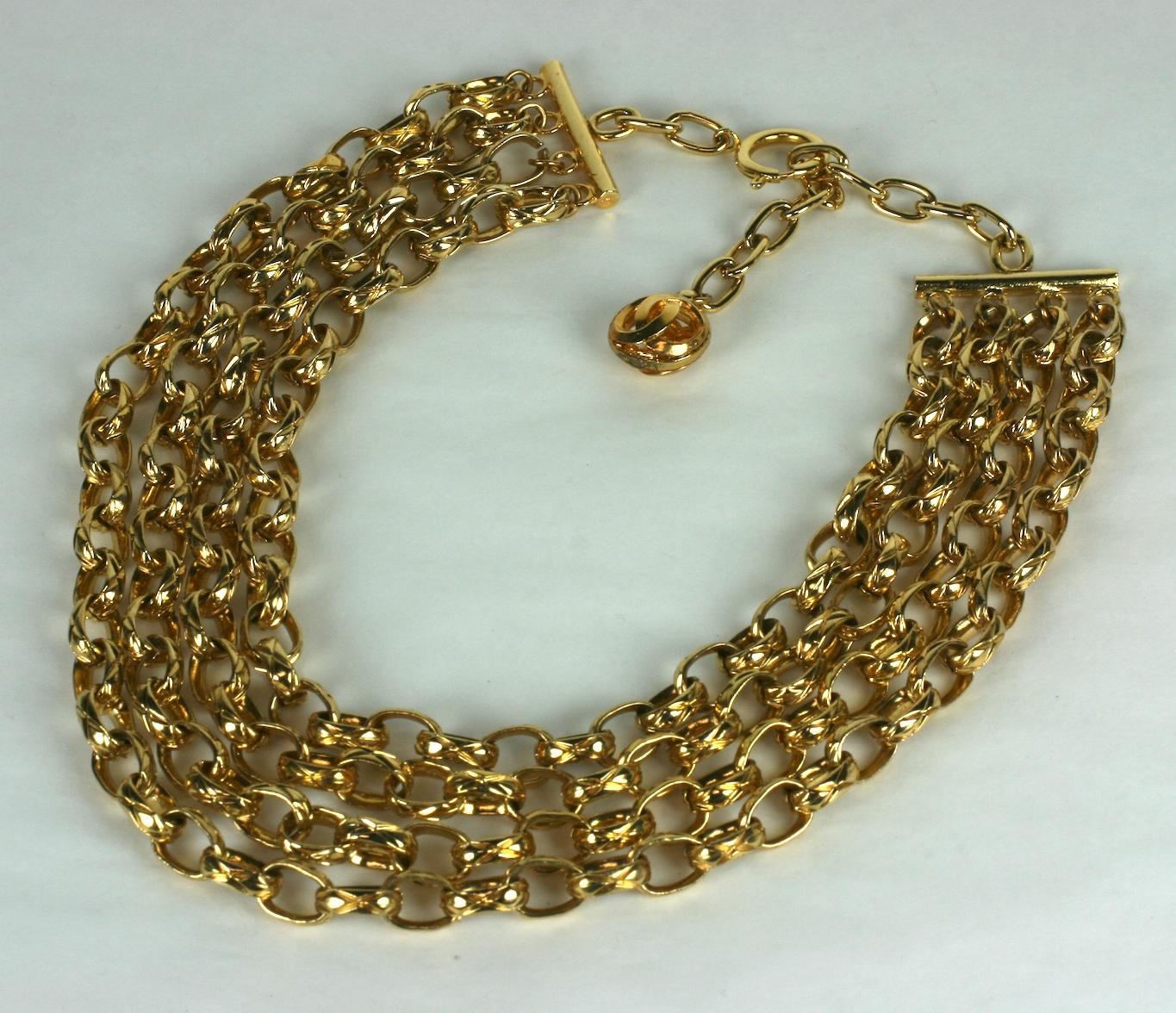 Lovely, classic Chanel 4 Strand Textured Gilt Bronze Chain Necklace in gilt bronze from the 1980's. CC Logo fob on back fastener. High quality construction.  1980's France. 
17