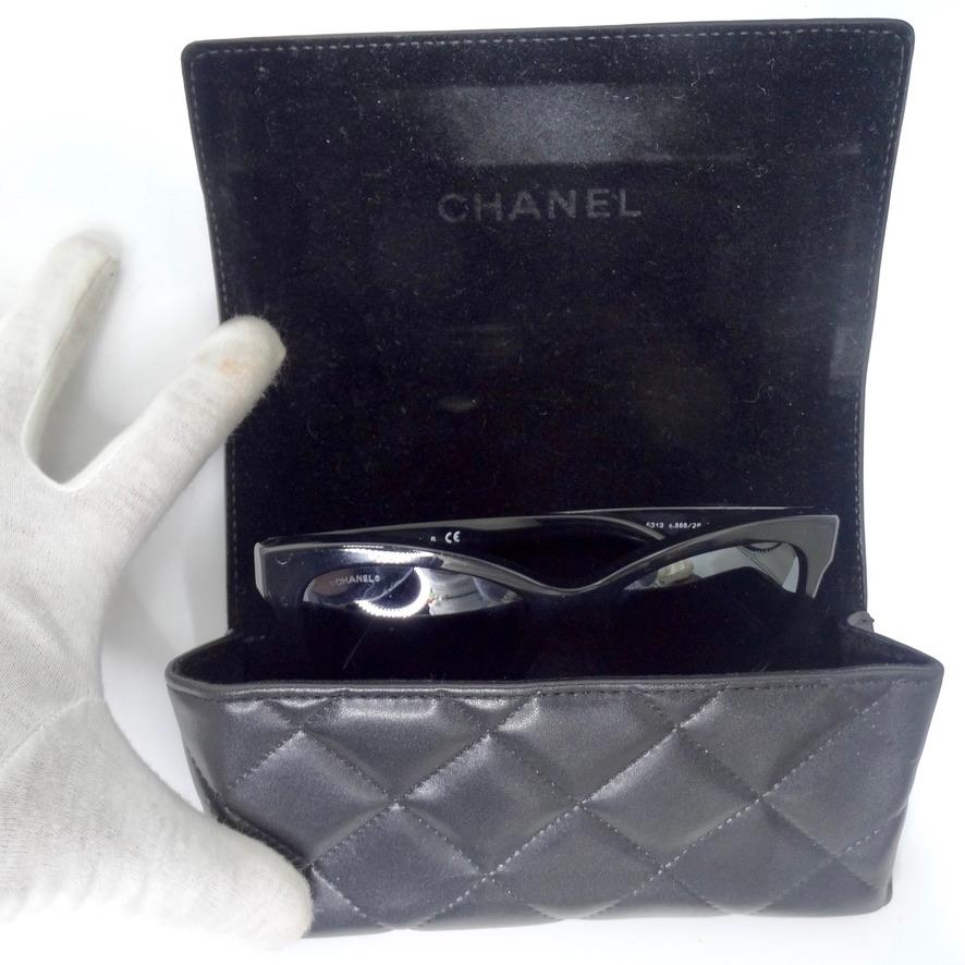 These Chanel 5313 Butterfly sunglasses are going to be your next go to pair of shades! Chanel presents their iconic 51313 butterfly silhouette in a classic black color way with grey lenses circa 2010s. The sunglasses are completed by silver