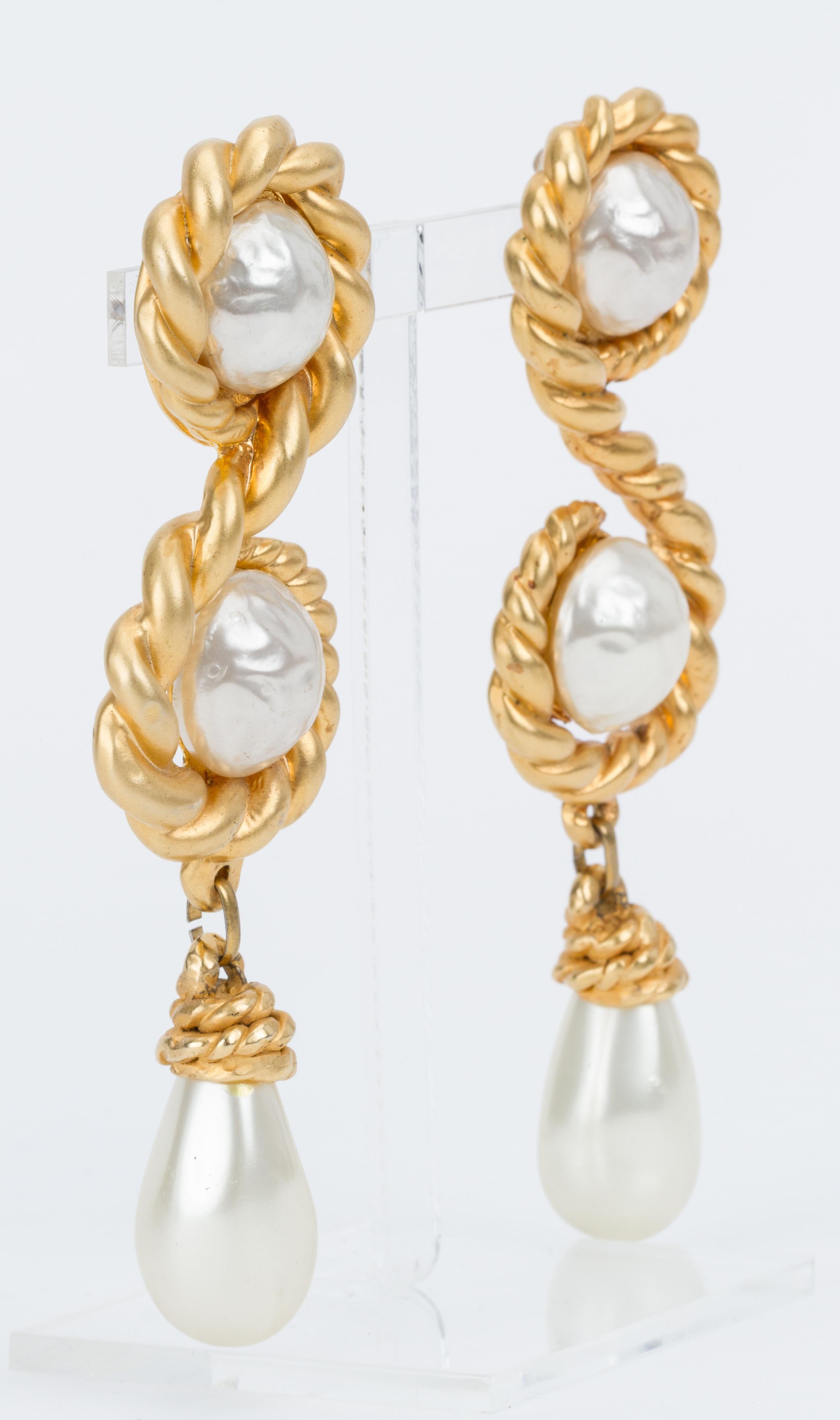 Chanel rare and collectible 70s oversized pearl drop earrings. Satin gold metal. Come with original box.
