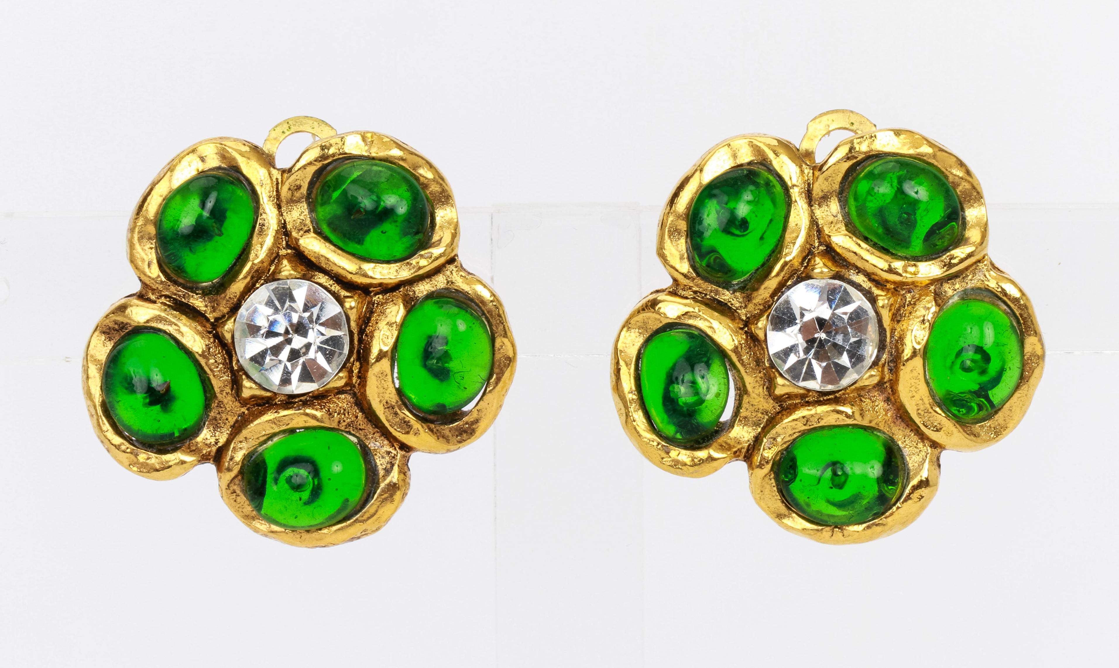 Chanel 70s flower earrings set in gold metal with 2 brilliant cut rhinestones at the center and five petals each featuring green cabochons gripoix