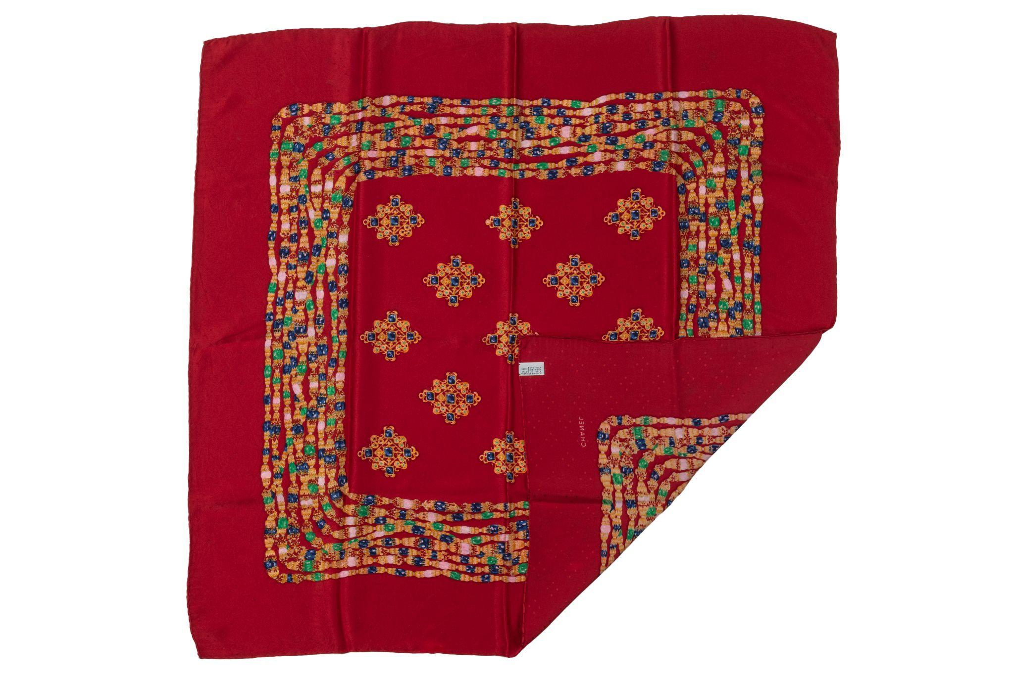 Chanel rare and collectible 80s red gripoix silk scarf. Minor stains. 
Composition label.