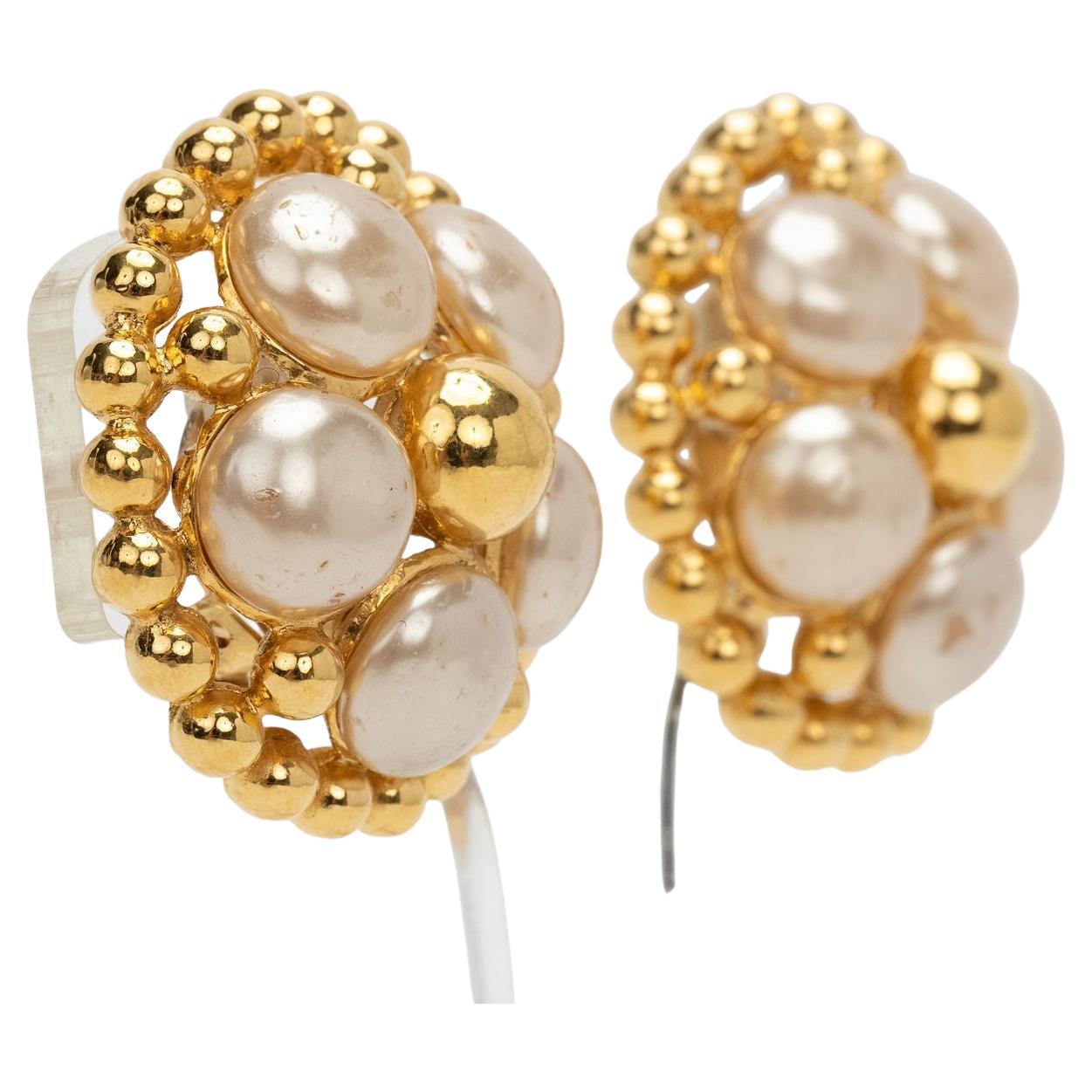 Chanel 80s Vintage Earrings in form of a flower with pearls being the leaves. Collection 25 by Victoire de Castellaine. Minor wear on one pearl, please refer to photos. In excellent condition.
