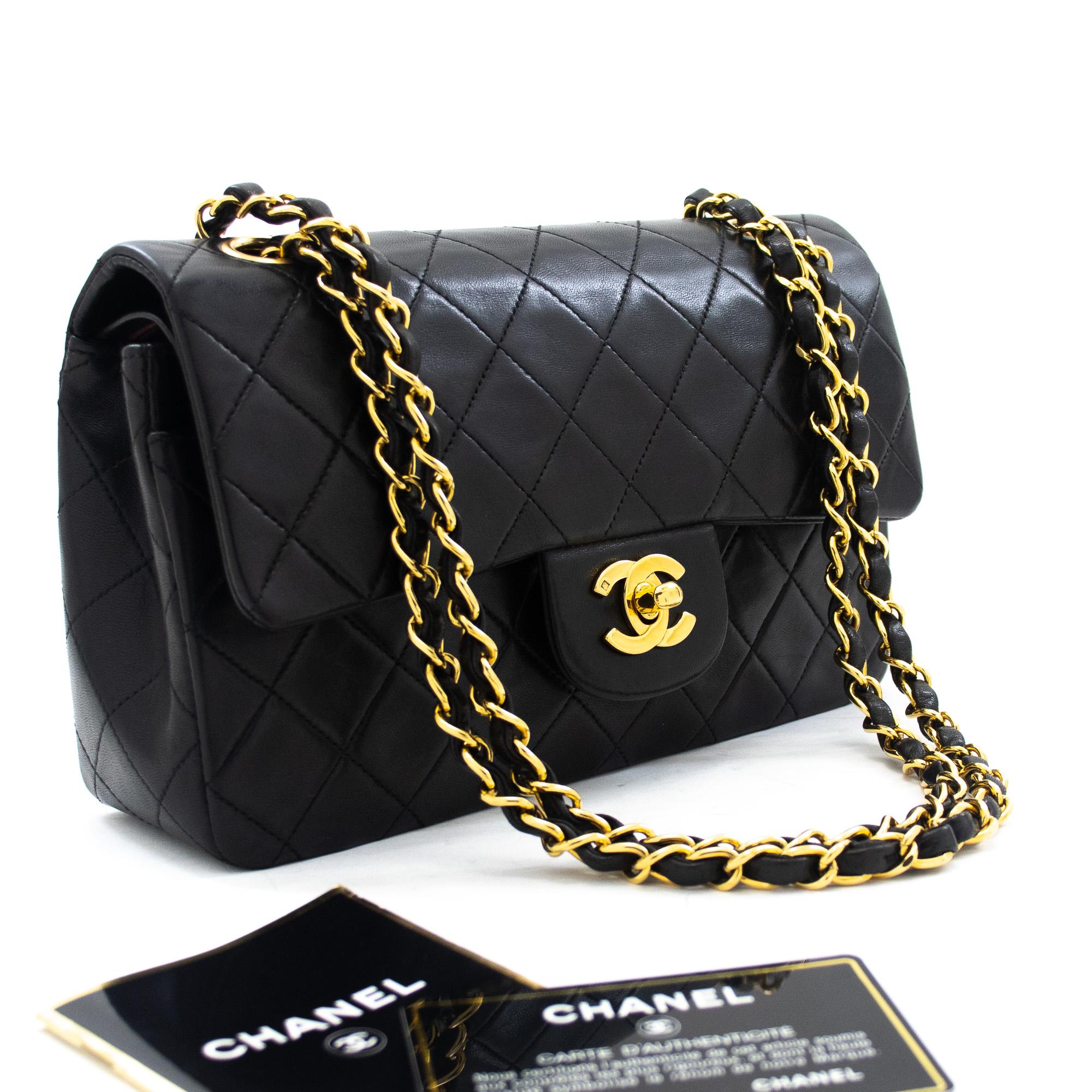 This iconic Chanel 9-inch double-flap bag has been crafted from quilted black lambskin and features a double flap. The front flap has been finished with the classic CC logo twist lock, with the second flap featuring a stud closure and one slip-in