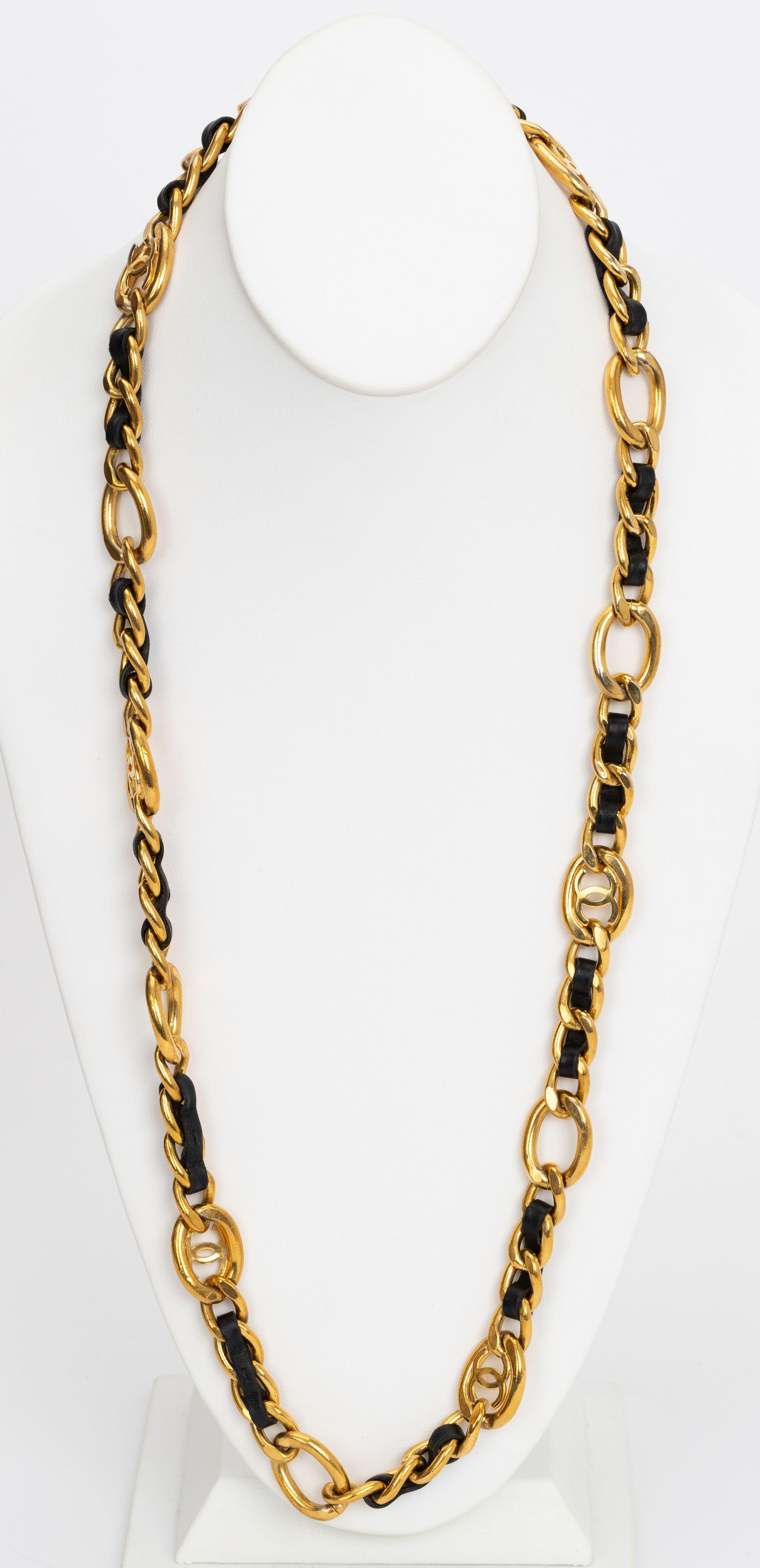 Chanel 90s 24 kt gold plated chain belt with black lambskin leather. Can be worn as a necklace or as a belt . Spring 96 collection. Comes with original dust cover or box.
