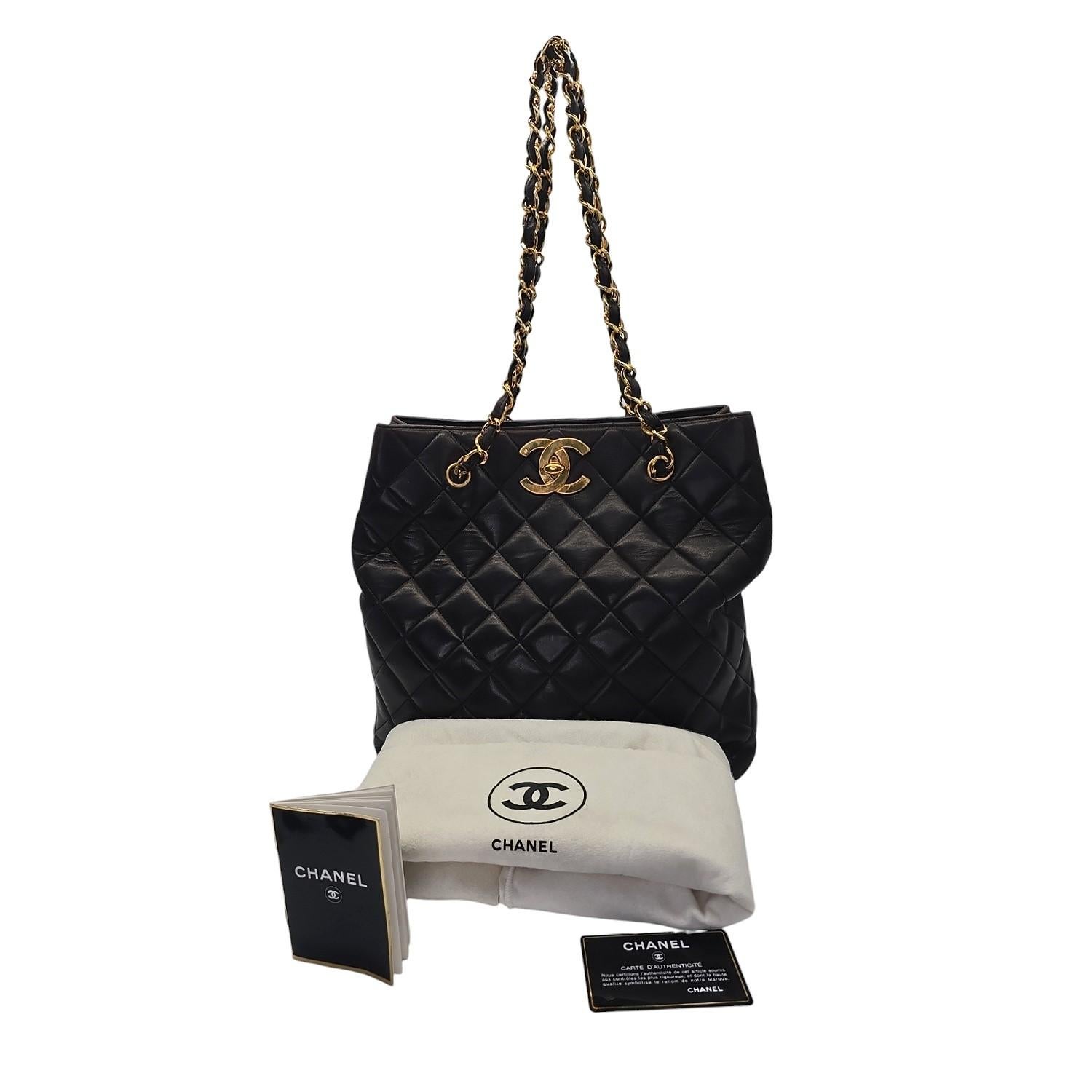 This striking shopper tote is crafted of luxurious diamond quilted lambskin leather in brown and features an oversized 24K plated gold CC turn-lock closure and gold chain-link leather threaded straps. The spacious leather interior, complete with a