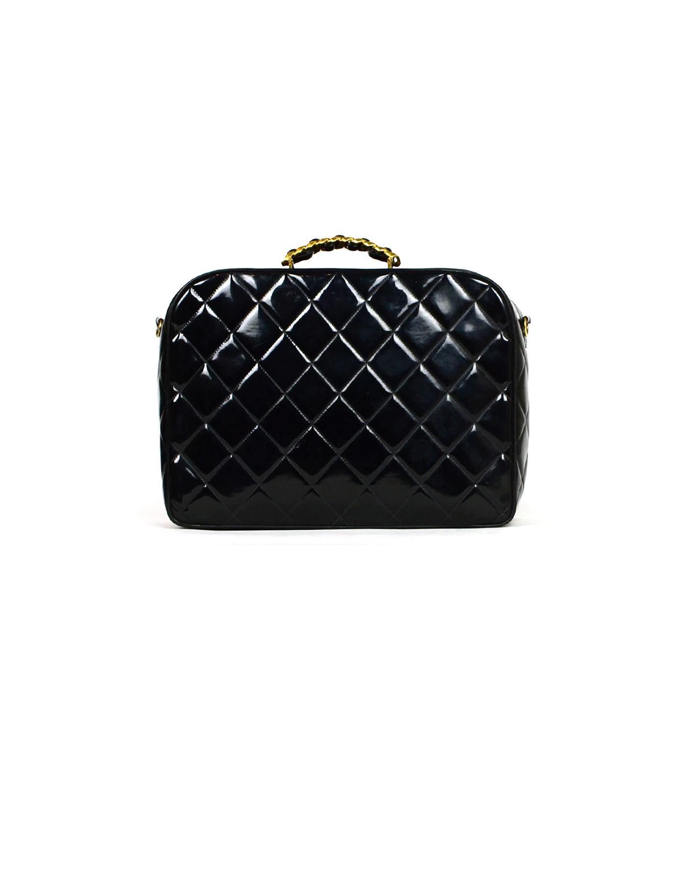 Chanel Vintage Black Patent Zip Around Bag

Made In: France
Year of Production: 1994-1996
Color: Black
Hardware: Goldtone
Materials: Patent Leather
Lining: Leather
Closure/Opening: Zip around
Exterior Pockets: None
Interior Pockets: One zip pocket,