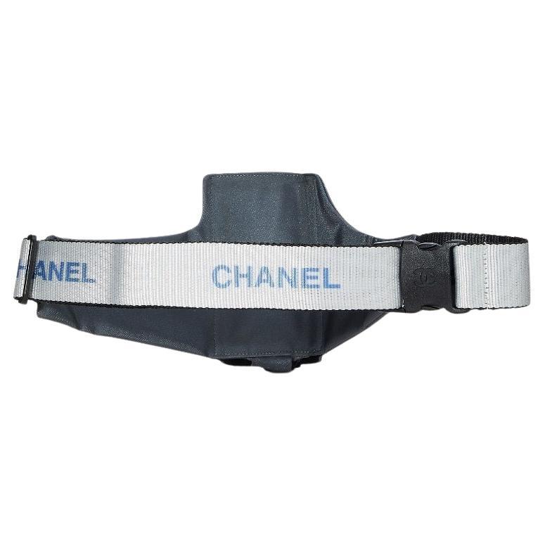 Chanel 90's Vintage Sport Water Bottle Waist Fanny Pack Gym Bag

1997-1999
Silver hardware
Reflective sporty grey-silver nylon
Adjustable logo waist strap
Snap logo CC buckle closure
Zip pocket and flap pocket with three card slots
Made in France