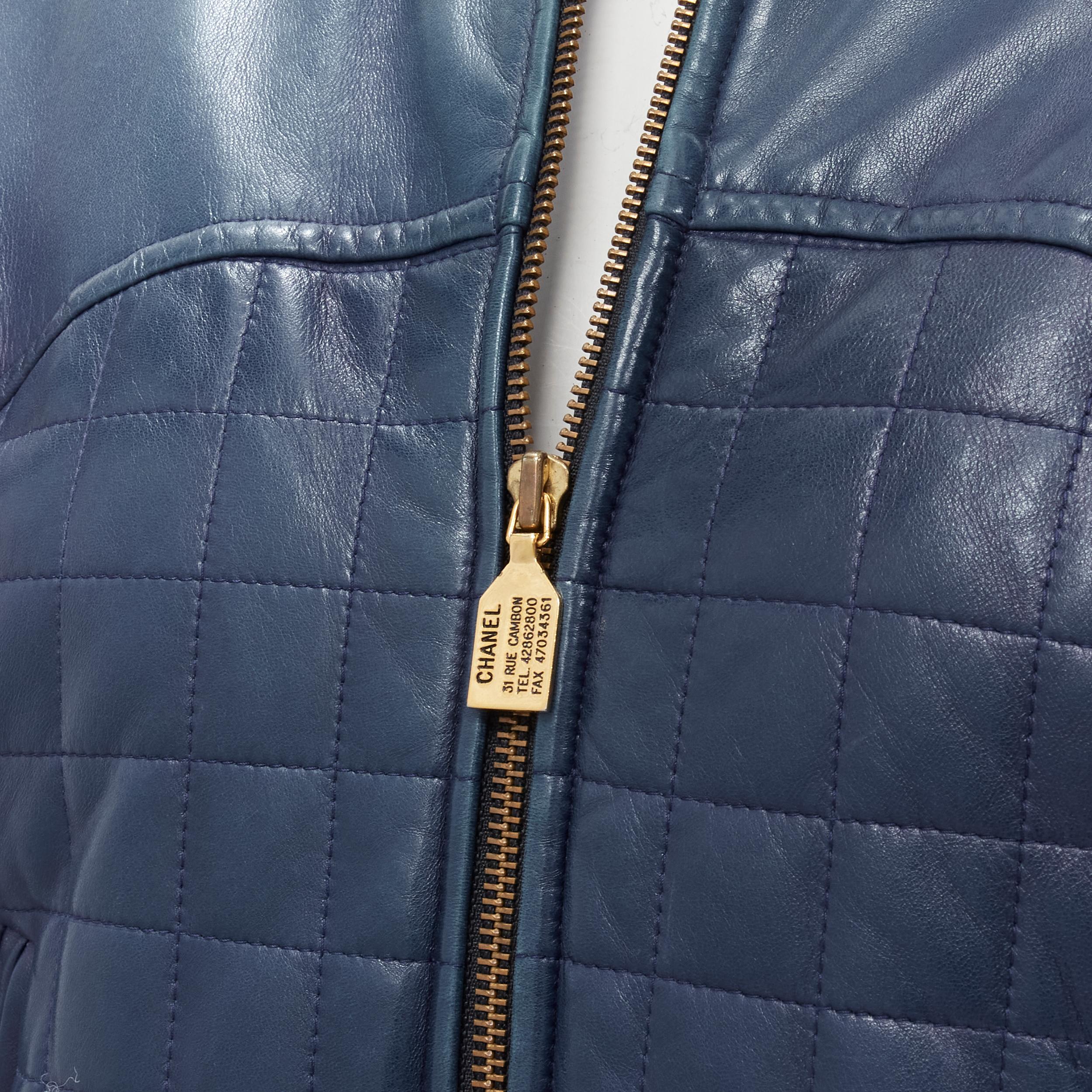 CHANEL 91A  gold 31 Rue Cambon zip charm navy quilted leather jacket FR44 XL
Brand: Chanel
Designer: Karl Lagerfeld
Collection: 91A 
Material: Leather
Color: Blue
Pattern: Solid
Closure: Zip
Extra Detail: Navy blue soft leather upper. Quilt