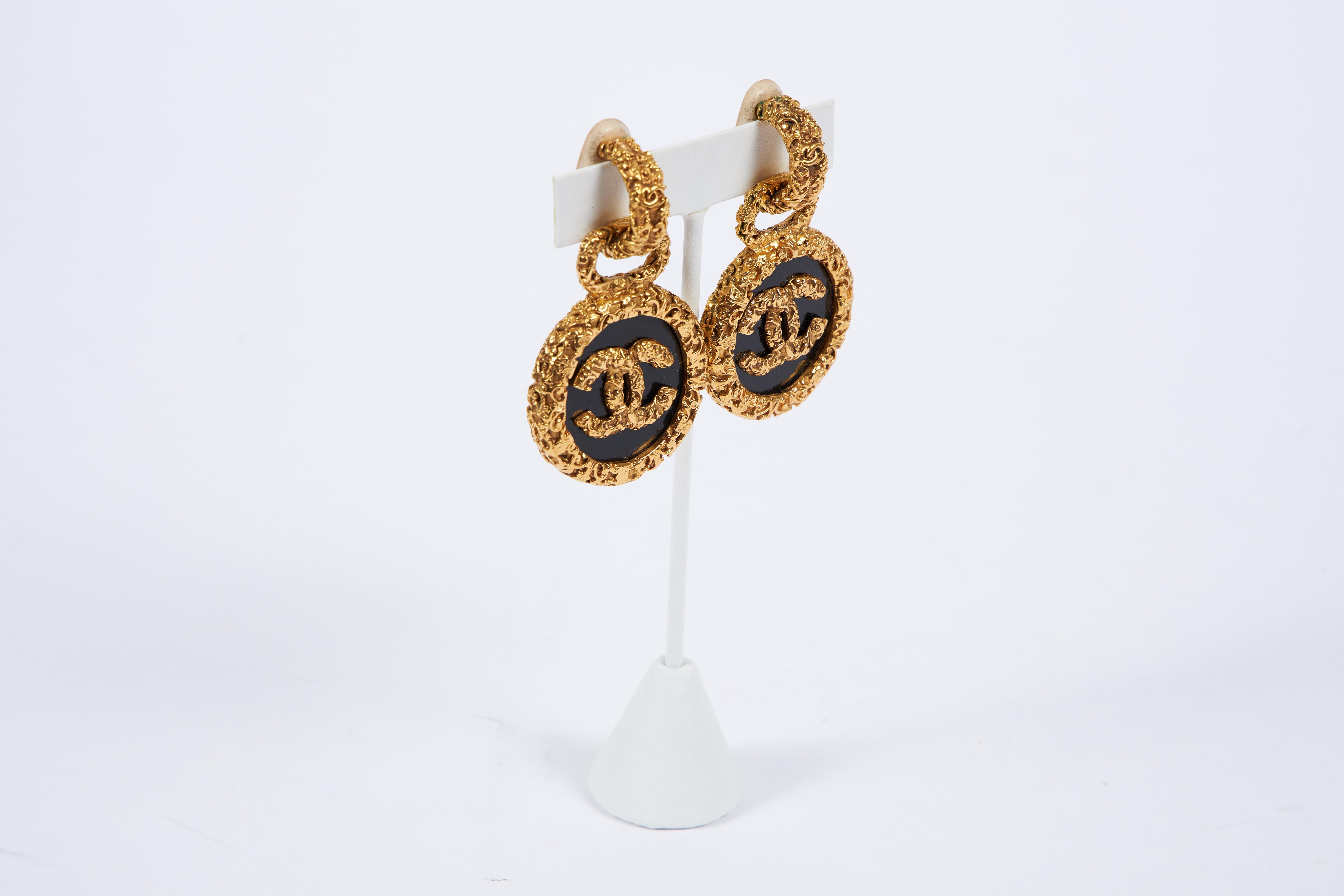 Chanel black glass Florentine drop earrings set in textured goldtone metal. Post backs. Autumn '93 collection. Original box included.