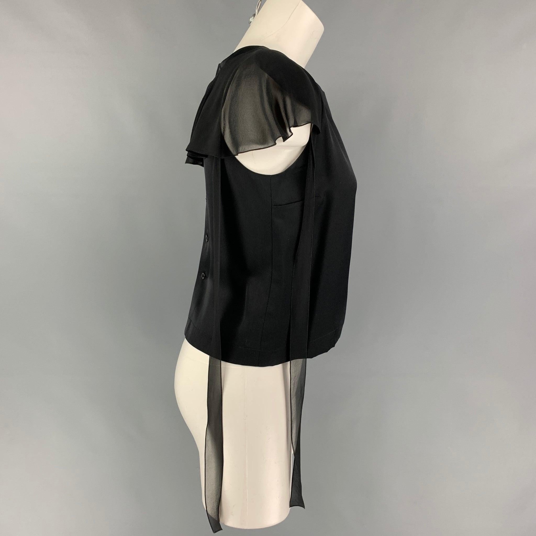 CHANEL top comes in a black silk featuring shoulder pads, strap details, ruffled panel, and a back button closure. Made in France.
Very Good
Pre-Owned Condition. 

Marked:   94305 03A / 36 

Measurements: 
 
Shoulder: 9.5 inches  Bust: 33 inches 