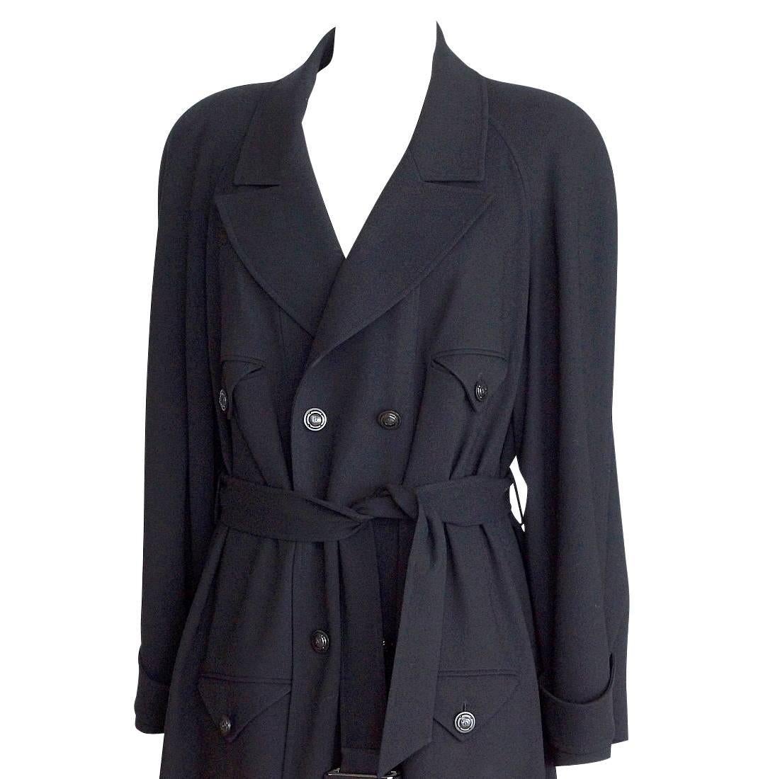 Guaranteed authentic CHANEL 97A gorgeous black wool trench style coat with feminine military inspiration.  Big trend this season.
Four on two double breasted jacket.
4 pockets that on the interior of the coat, so only the flaps show.
The flaps are