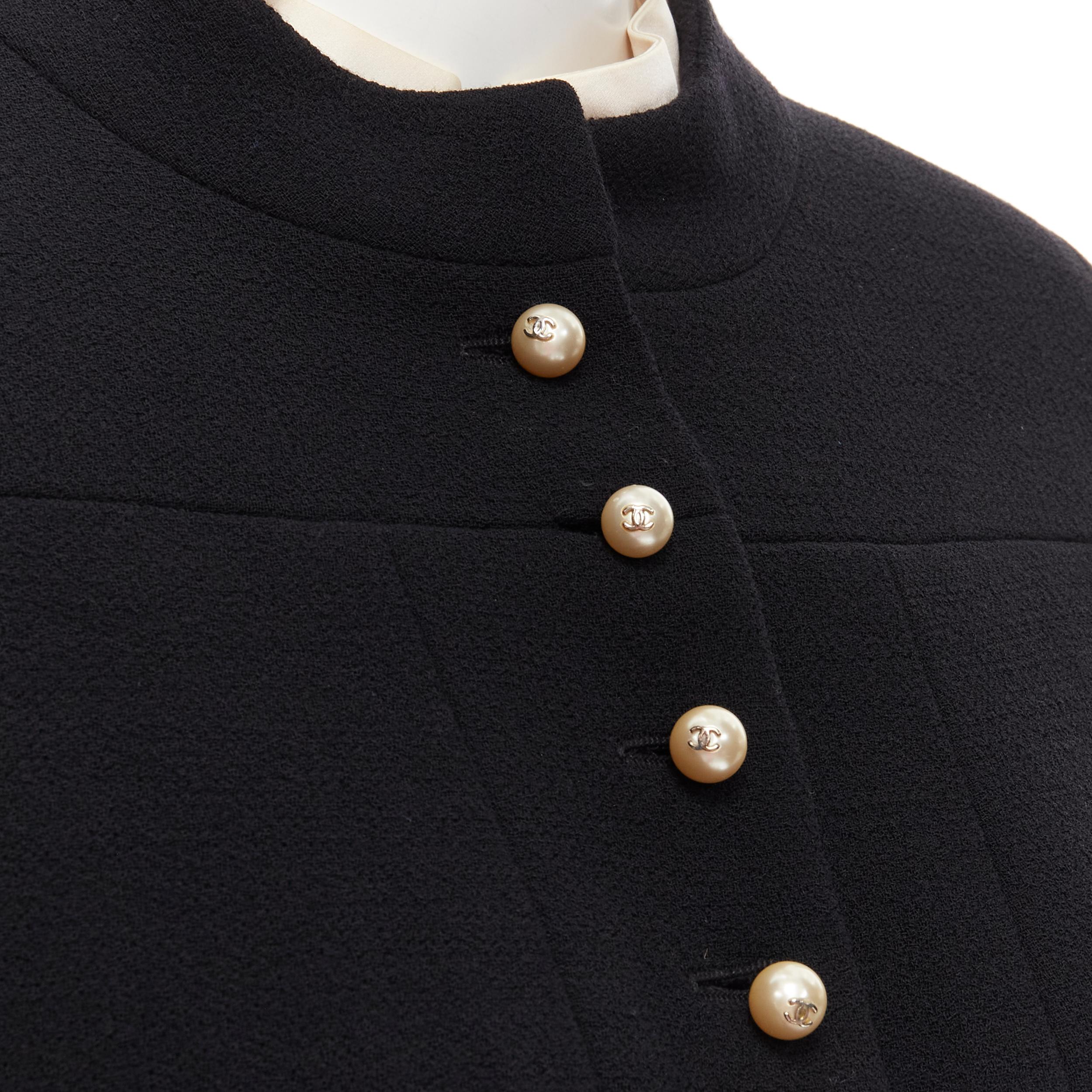CHANEL 97A Vintage black wool CC pearl buttons panelled 4-pocket jacket FR40 M 
Reference: GIYG/A00169 
Brand: Chanel 
Designer: Karl Lagerfeld 
Collection: 97A 
Material: Wool 
Color: Black 
Pattern: Solid 
Closure: Button 
Extra Detail: Black wool