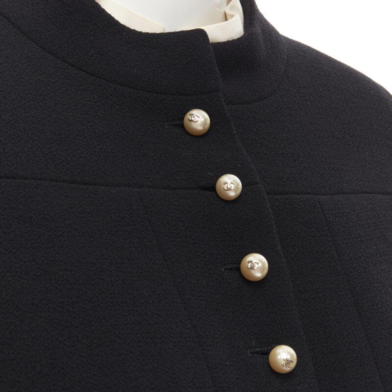CHANEL 97A Vintage black wool CC pearl buttons panelled 4-pocket jacket FR40 M
Reference: GIYG/A00169
Brand: Chanel
Designer: Karl Lagerfeld
Collection: 97A
Material: Wool
Color: Black, White
Pattern: Solid
Closure: Button
Lining:  Silk
Extra