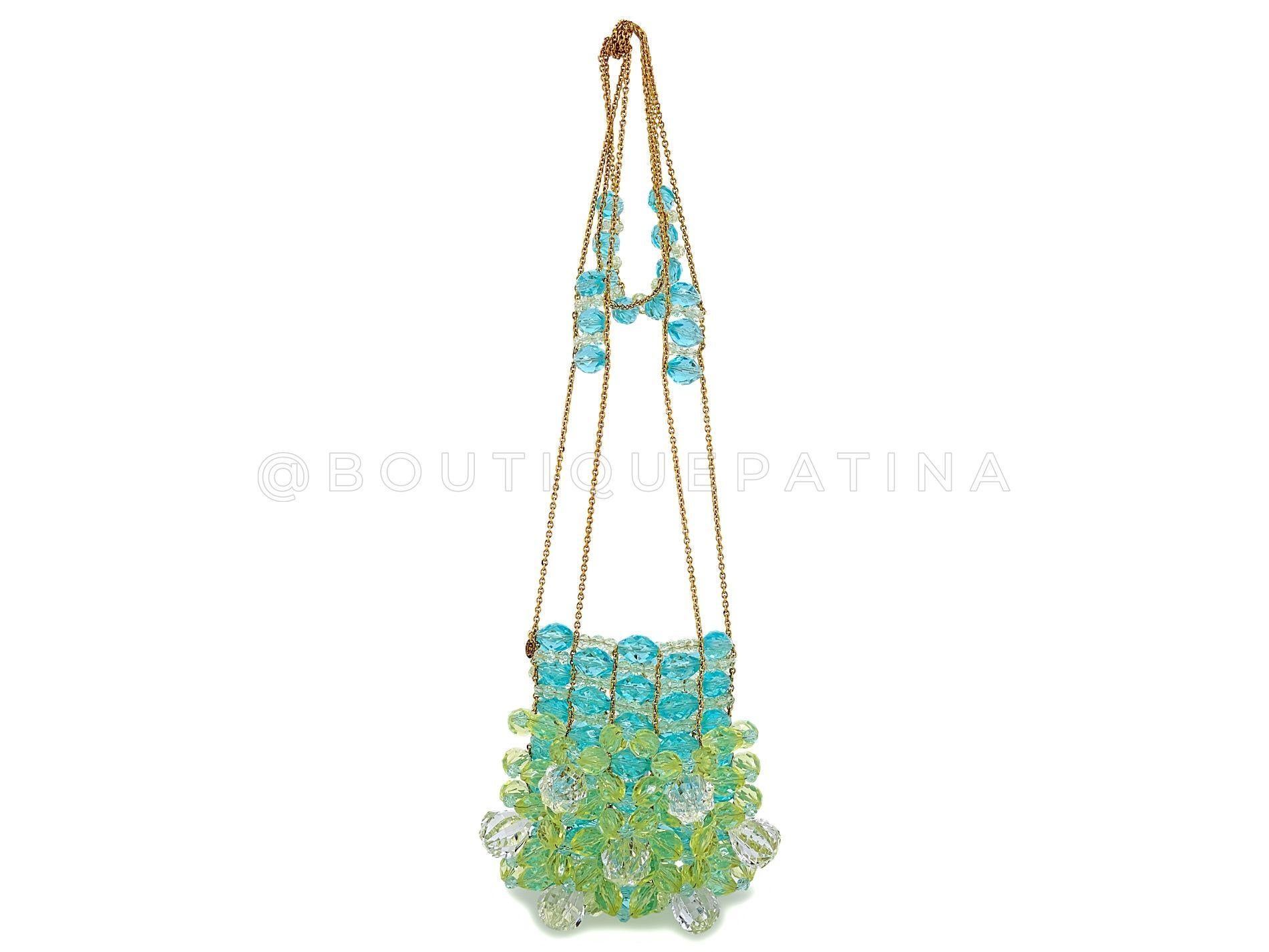 Store item: 68453
This Chanel 97P Vintage Lucite Crystal Beaded Evening Bag 24k GHW is a rare find. Made solely of faceted lucite beads in white, green and turquoise pastel hues joined by a 24k gold plated micro-chain, this evening bag was a super
