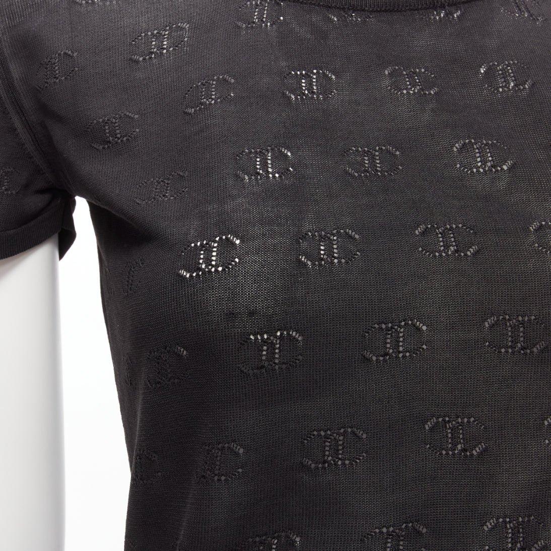 CHANEL 98P Vintage black CC logo monogram Pointelle silk knitted top FR38 M
Reference: TGAS/D00215
Brand: Chanel
Designer: Karl Lagerfeld
Collection: 98P
Material: Silk
Color: Black
Pattern: Solid
Closure: Slip On
Extra Details: CC logo lattice