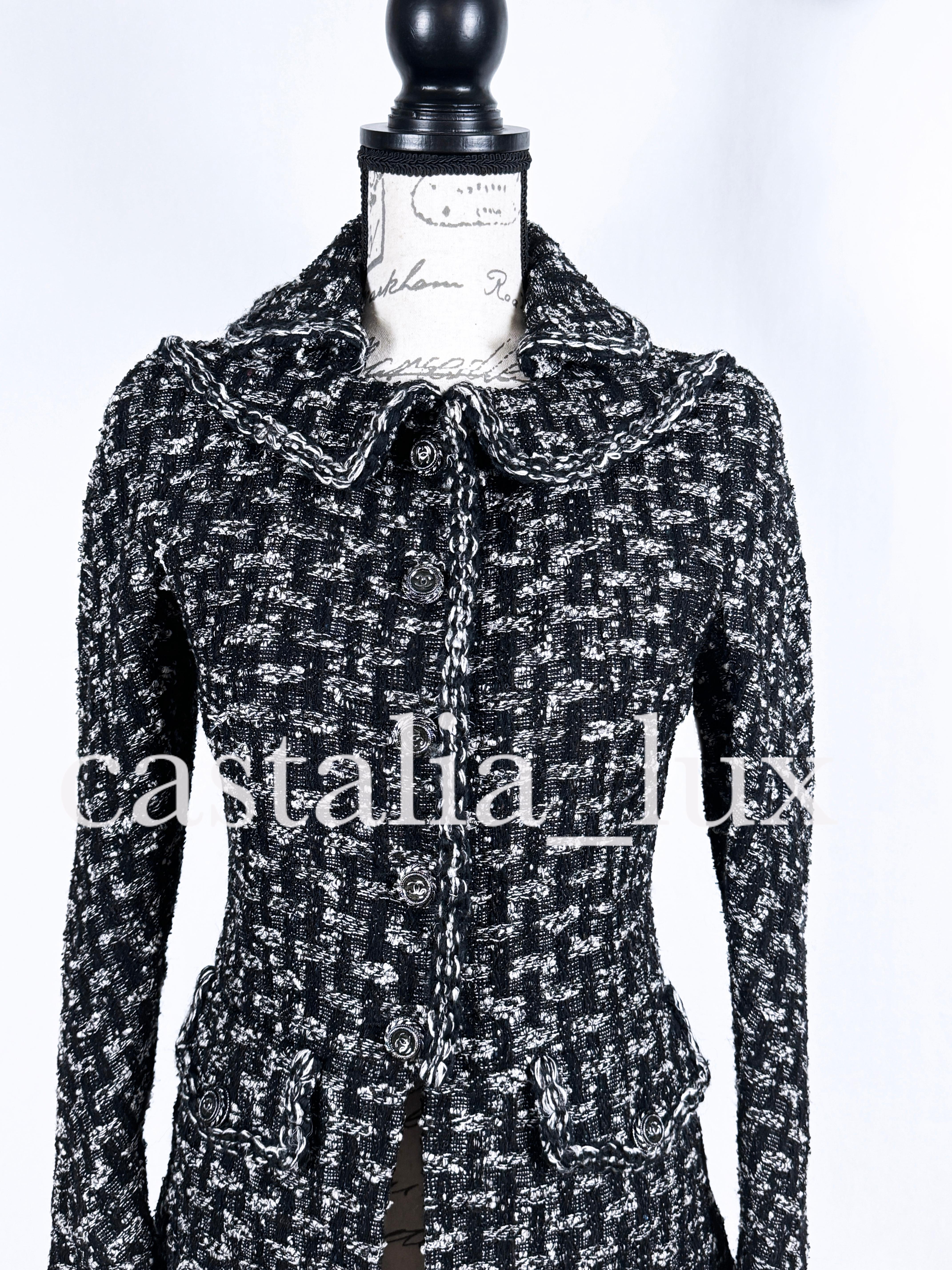 Iconic Chanel black tweed jacket with massive CC logo buttons from Paris / EDINBURGH Collection by Karl Lagerfeld. 
- boutique price over 9,000$
- signature braided trim
- black silk lining with camellias, chain link at hem
Size mark 36 FR. Kept