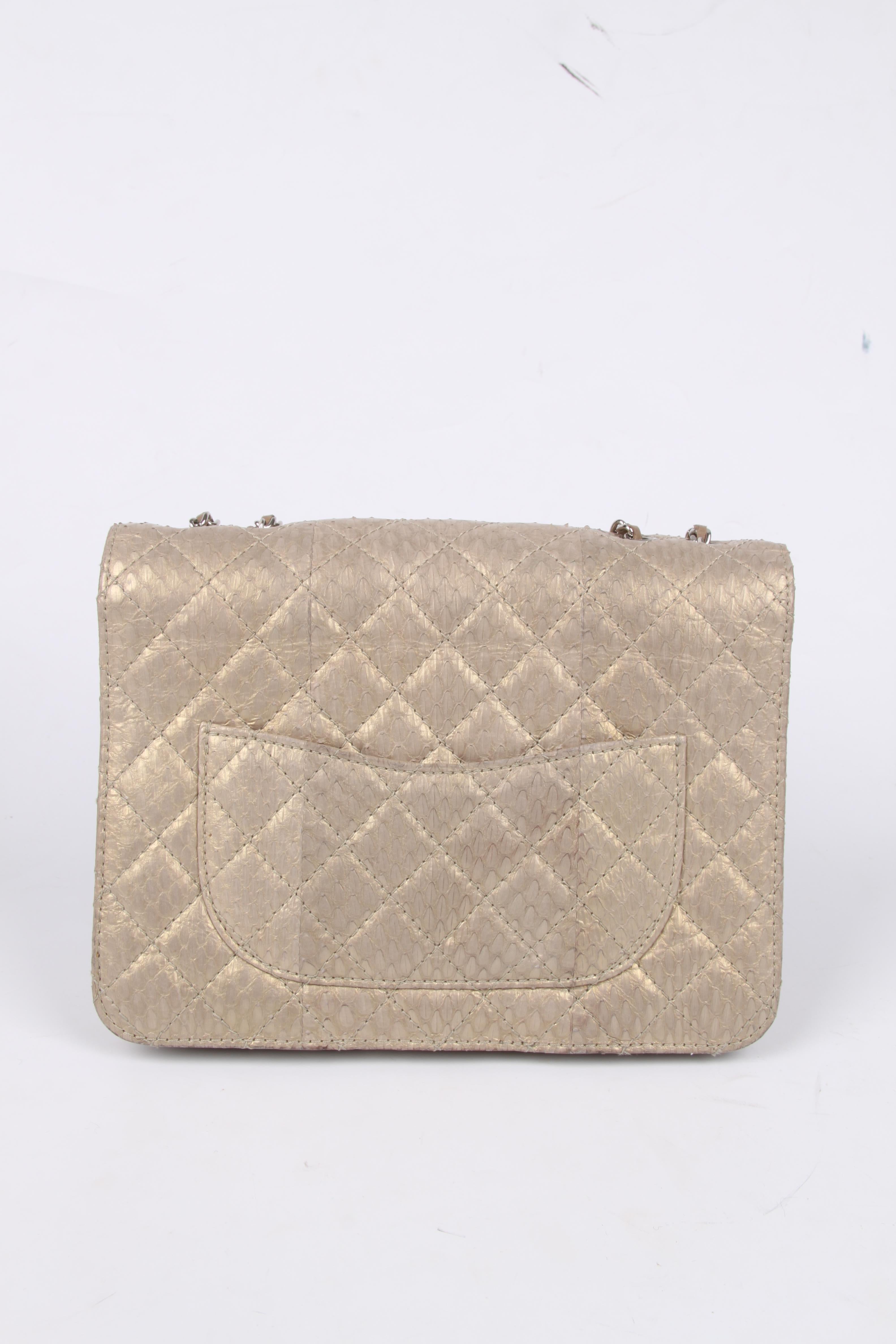 Fantastic Chanel Accordeon Flap Bag executed in matte golden python leather with a green undertones.

Front closure with a silver-tone CC turnlock, the thin chain is entwined with taupe coloured leather and can be worn single (122 cm) or double (69