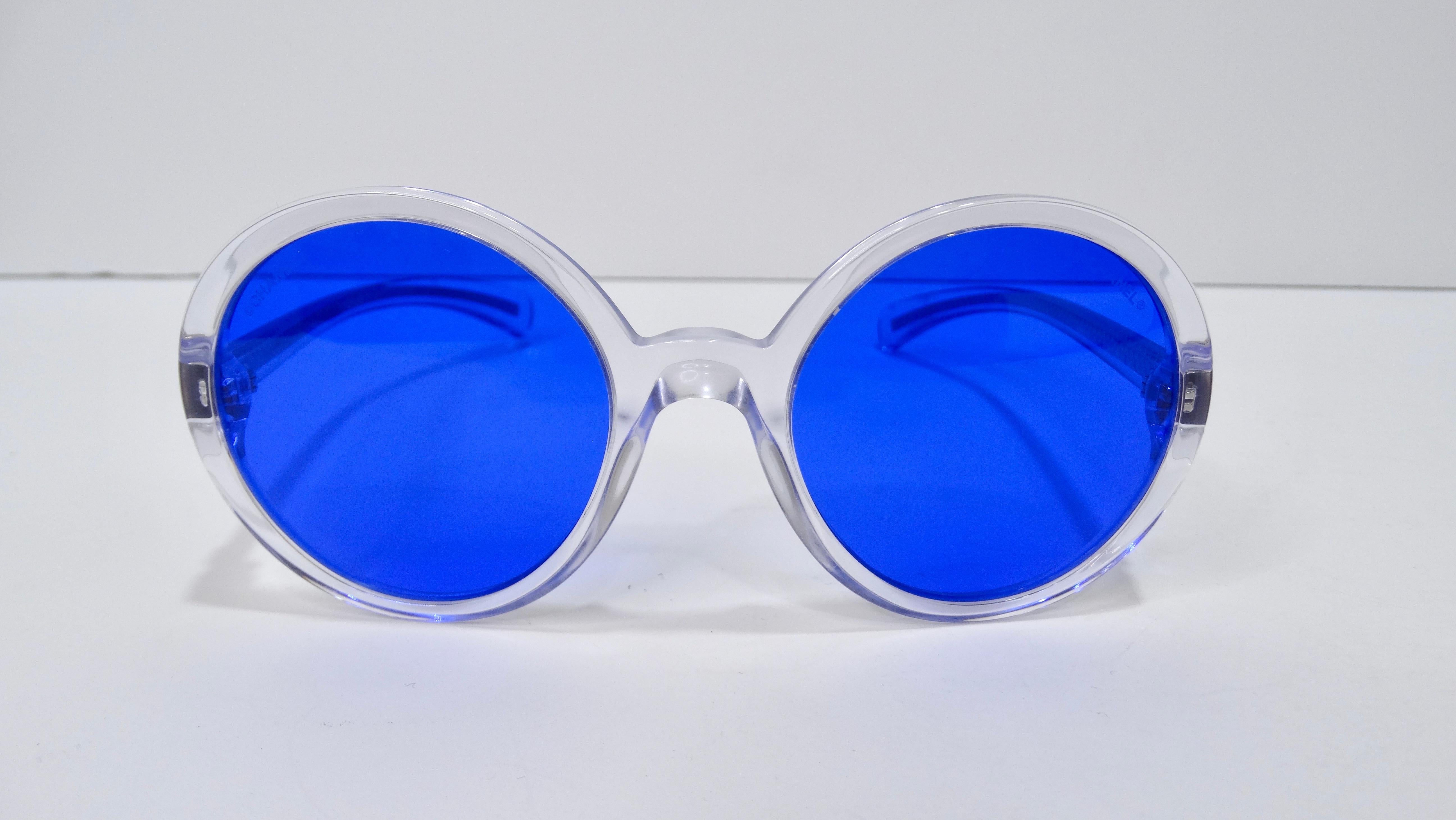 A funky and fun pair of sunglasses to add to your collection. Put your black sunnies to the side and let these electric blue Chanel's shine! These stunning sunglasses have a retro frameless style with lenses with a blue tint. The narrow arms have a