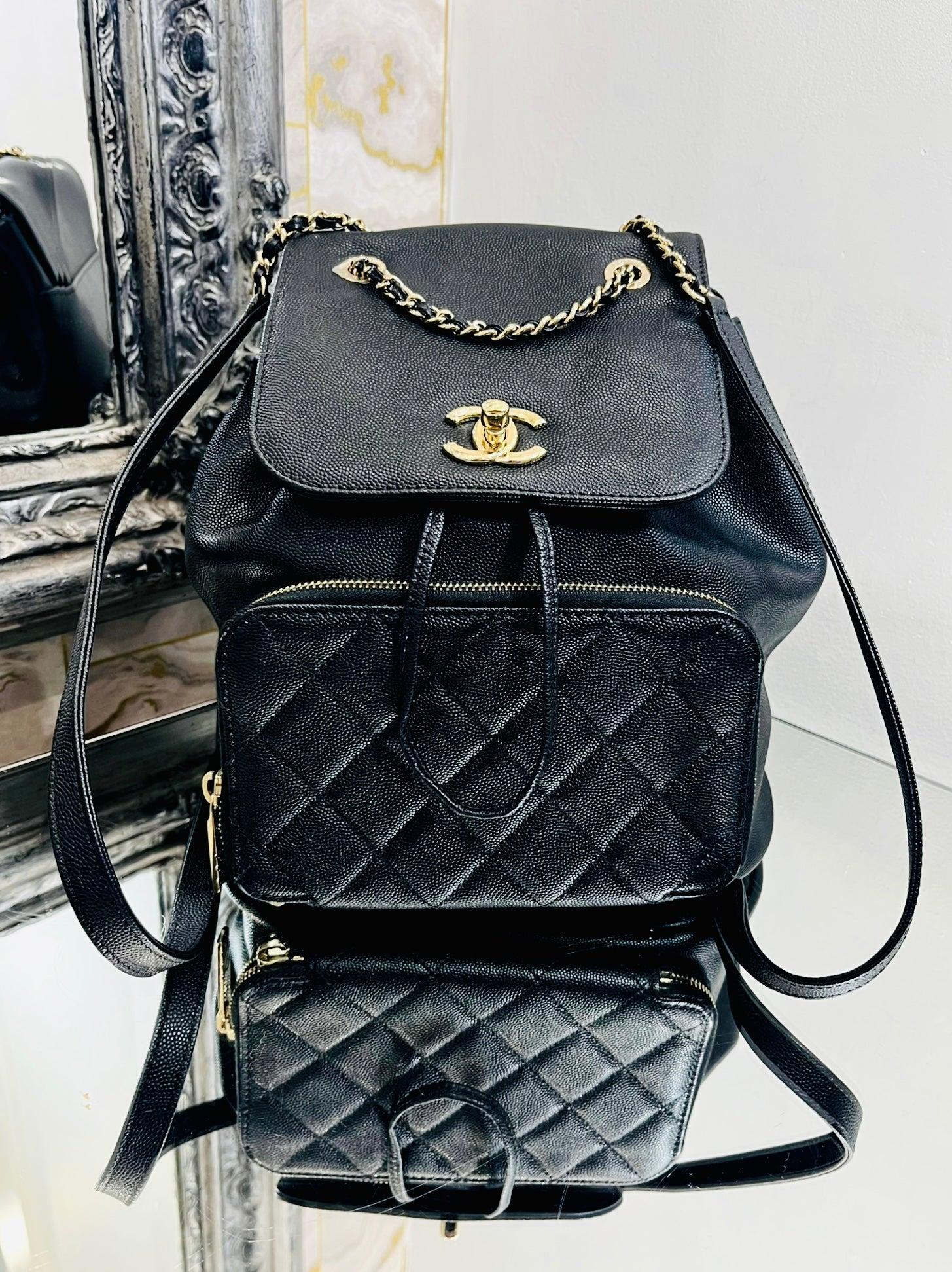 Chanel Affinity Caviar Leather Backpack

Caviar and quilted, diamond stitch leather with champagne gold 'CC'

logo hardware. Timeless twist lock closure, Drawstring pull, zipper compartment

to front and open back pocket to rear.

Size - Height