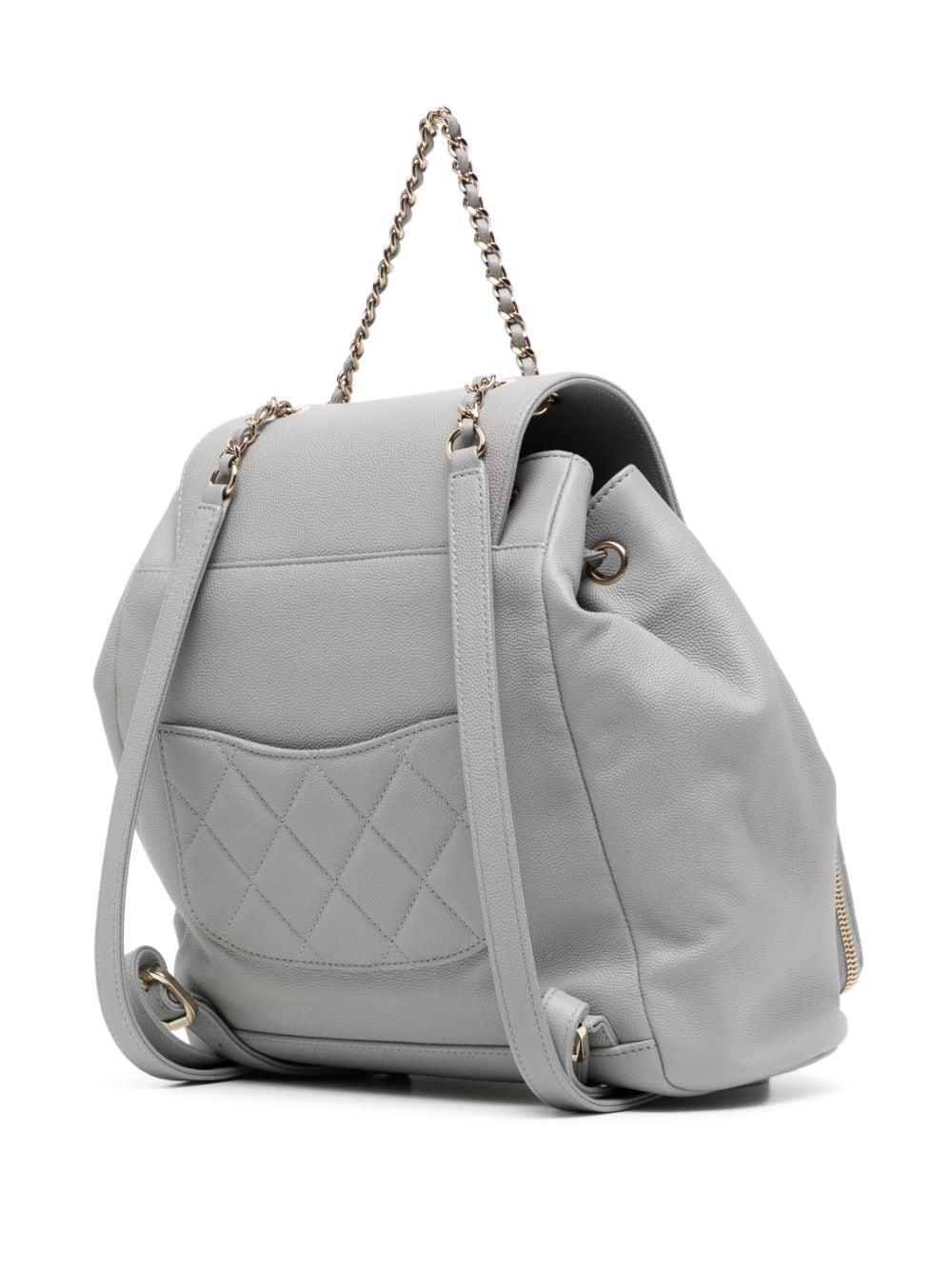 * Light grey-grained calf leather
* Diamond-quilted detailing
* Signature interlocking CC turn-lock fastening
* Foldover top with magnetic fastening
* Drawstring fastening
* Two leather and chain-link shoulder straps
* Rear patch pocket
* Front