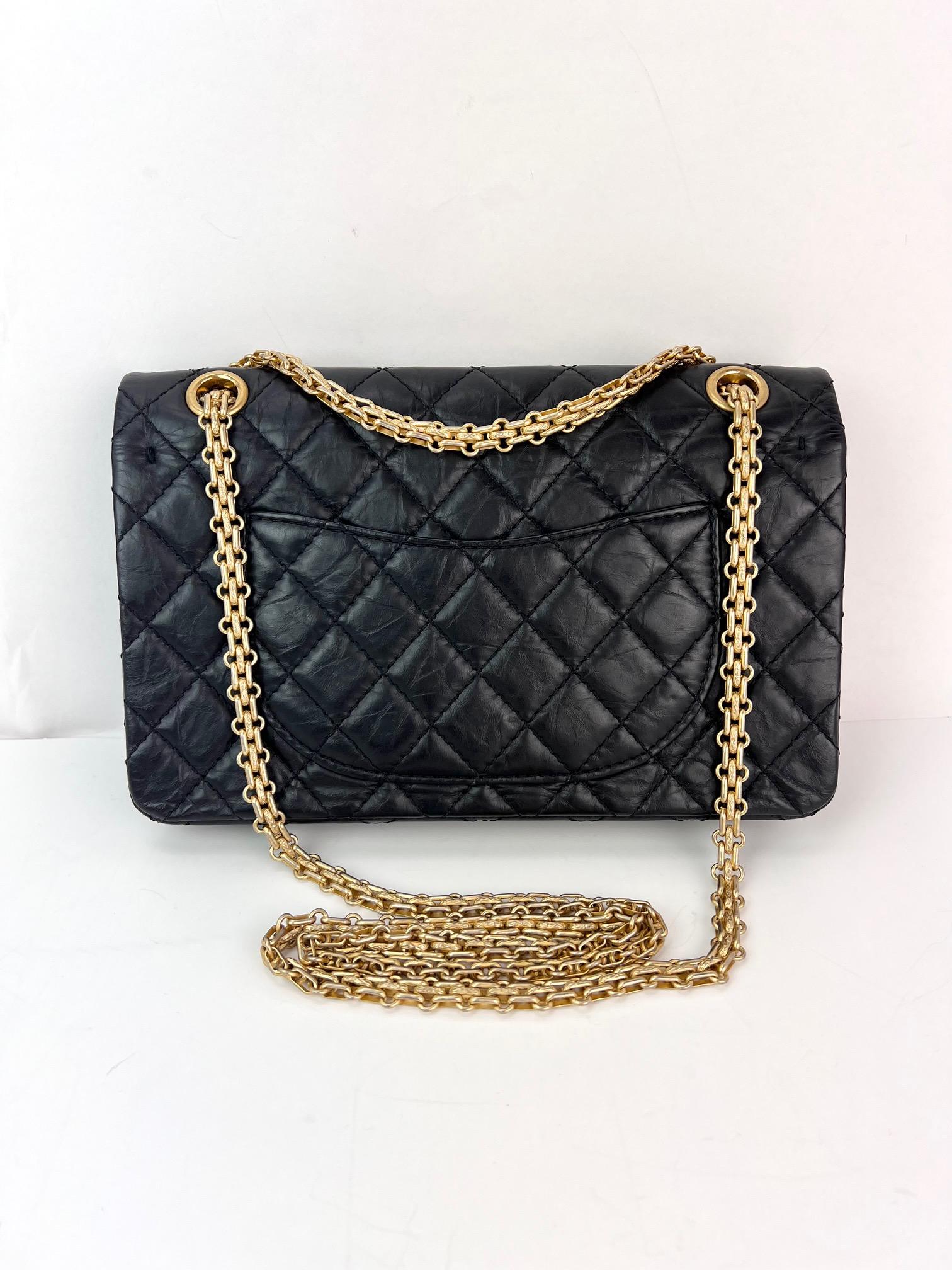 This is an authentic CHANEL Aged Calfskin Casino 2.55 Reissue 224 Flap in Black. This stylish shoulder bag is finely crafted of aged diamond quilted calfskin leather in black, adorned with exquisitely detailed iconic Chanel charms. The bag features