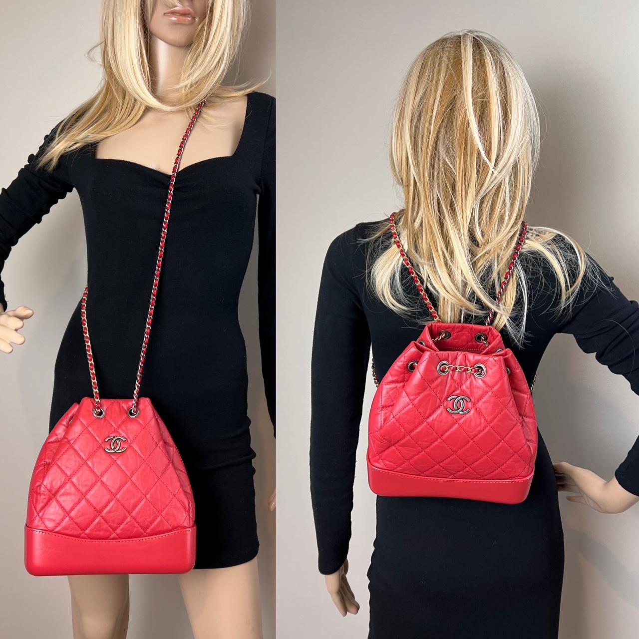 Pre-Owned  100% Authentic
Chanel Aged Calfskin Quilted Small Gabrielle Red Backpack 
RATING: A...excellent, near mint, has little to no signs of wear
MATERIAL: calfskin leather 
STRAP: leather woven inside different color chains is sliding on 
each