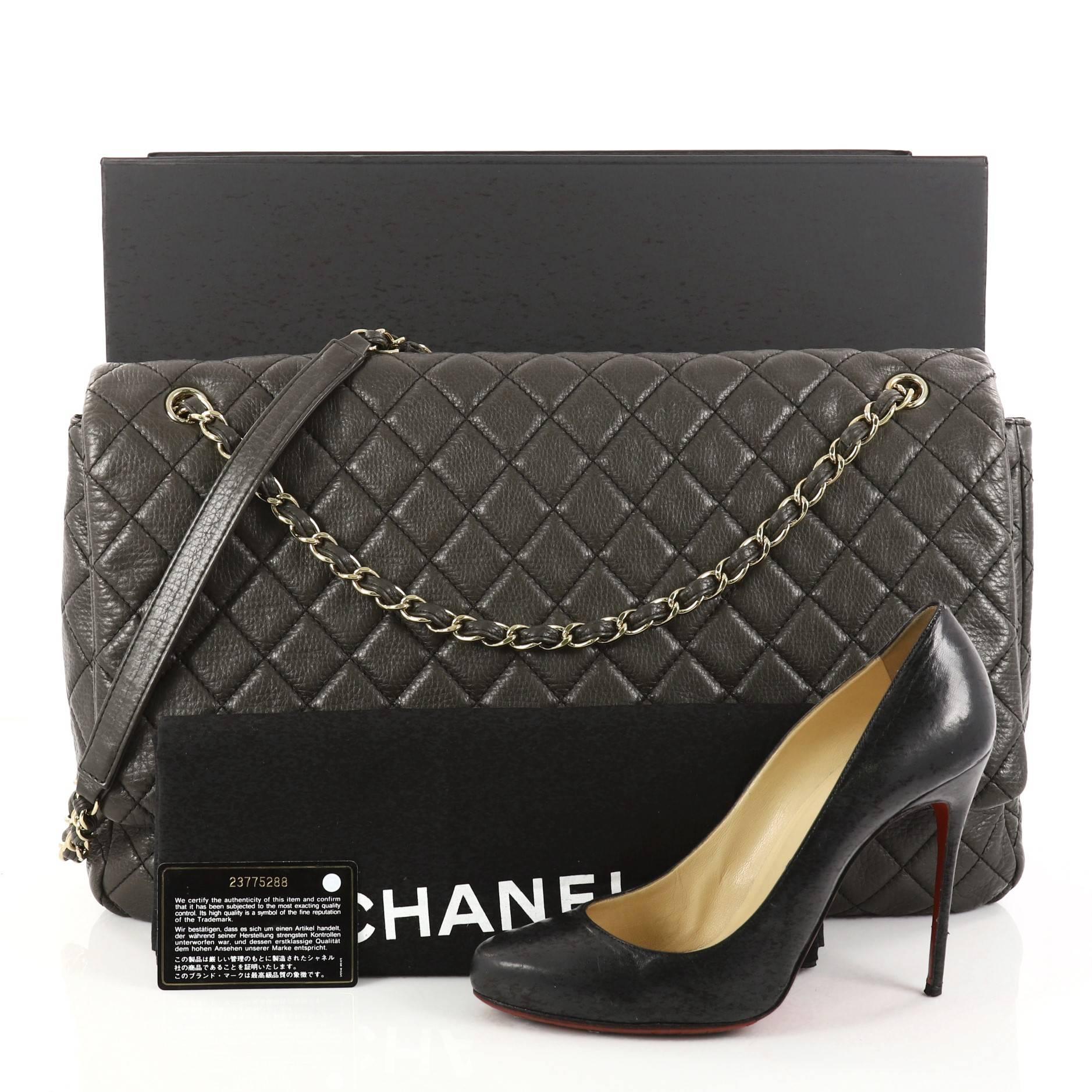 This authentic Chanel Airlines CC Flap Bag Quilted Calfskin XXL is an oversized travel beauty made for all Chanel lovers. Crafted in olive green calfskin leather in signature diamond quilting, this larger-than-life flap bag features woven-in leather