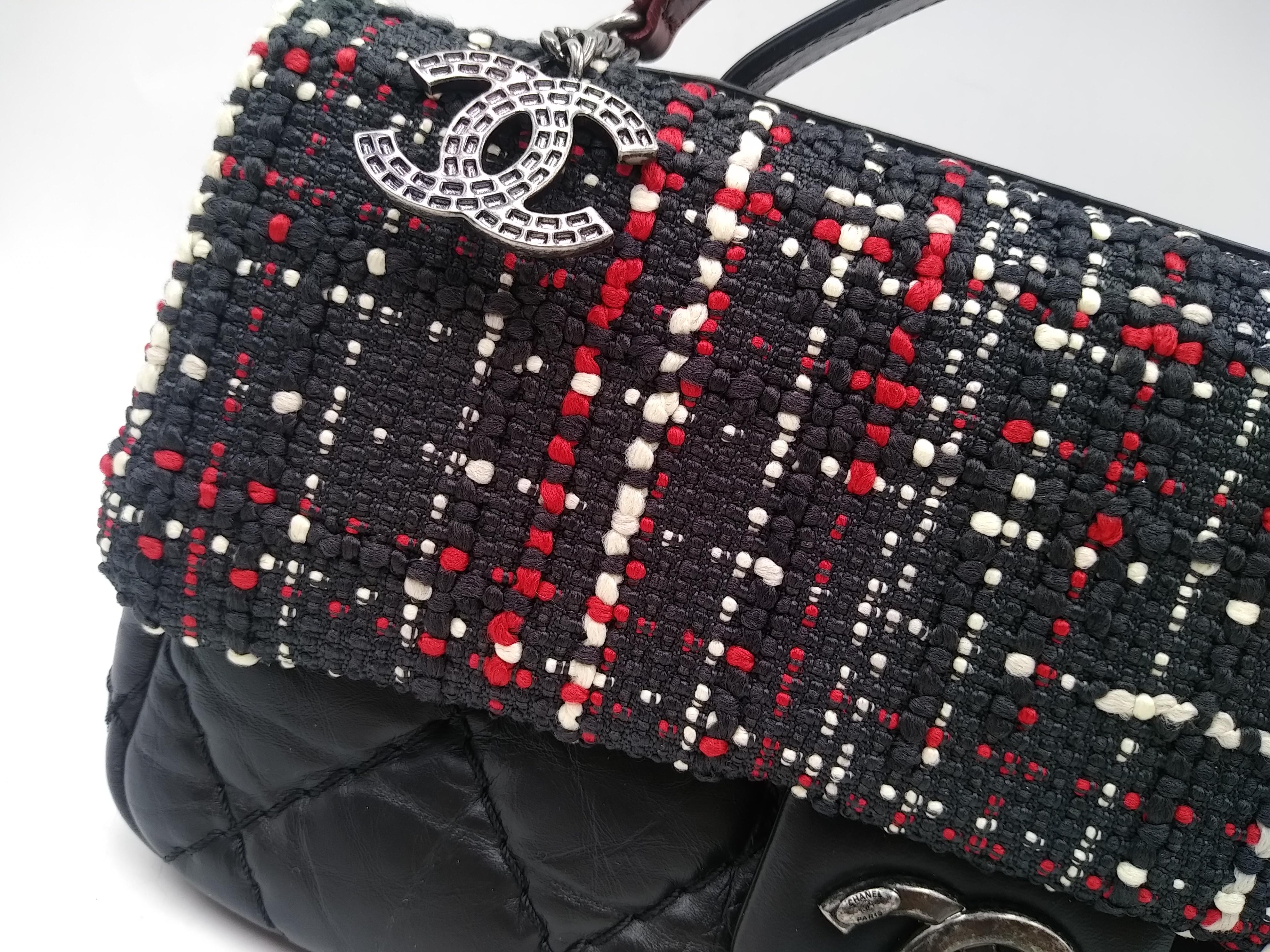 Chanel Airlines Top Handle Flap Bag Tweed and Quilted Aged Calfskin Medium, 2017
- 100% authentic Chanel
- black quilted calfskin and multicolor tweed
- leather top handle and woven-in leather chain strap
- CC turn-lock closure 
- red fabric