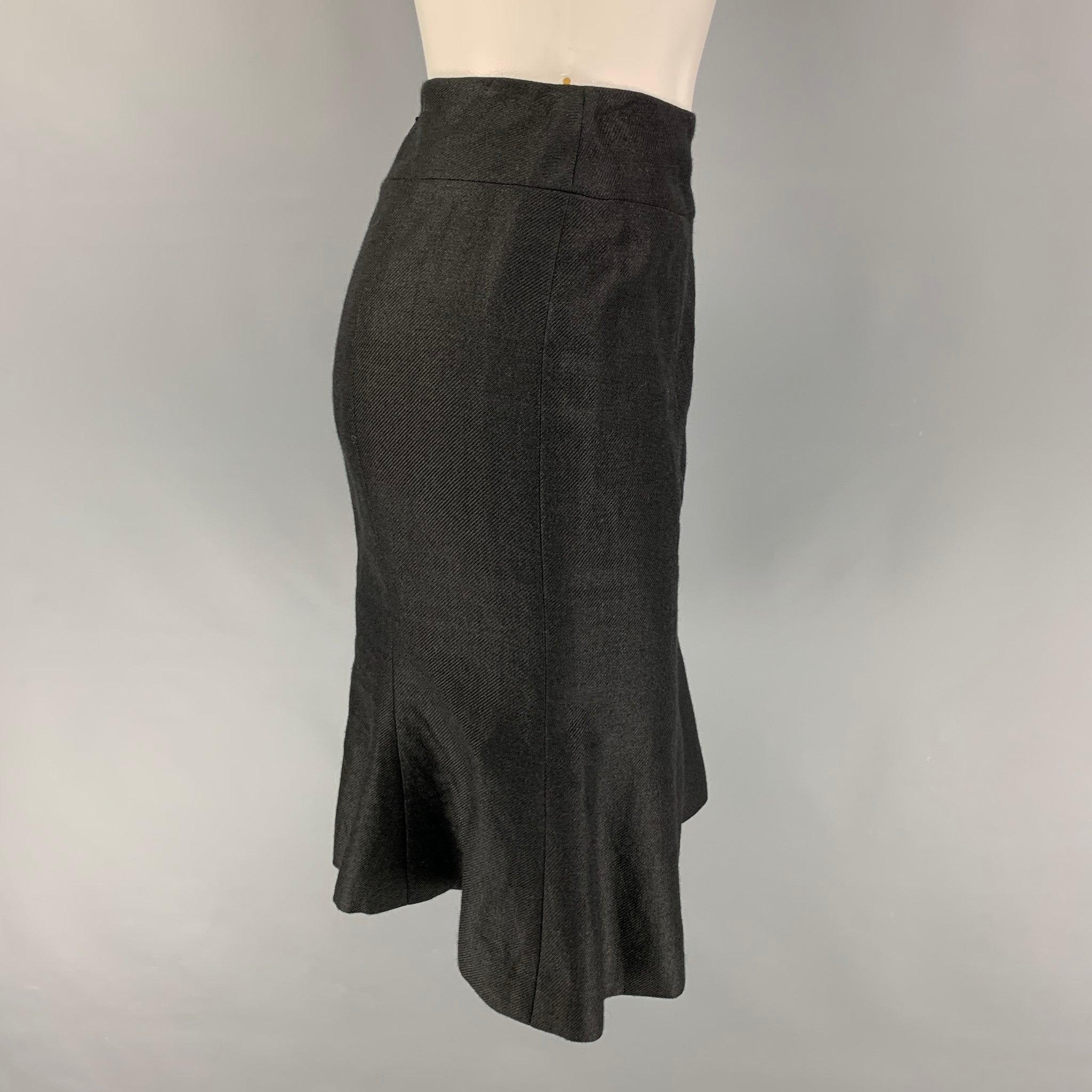 CHANEL skirt comes in a black linen featuring a trumpet style, logo emblem, and a back zipper closure. Made in France.
Very Good
Pre-Owned Condition. 

Marked:   AL716 05C / 36 

Measurements: 
  Waist: 28 inches  Hip: 35 inches  Length: 21.5 inches