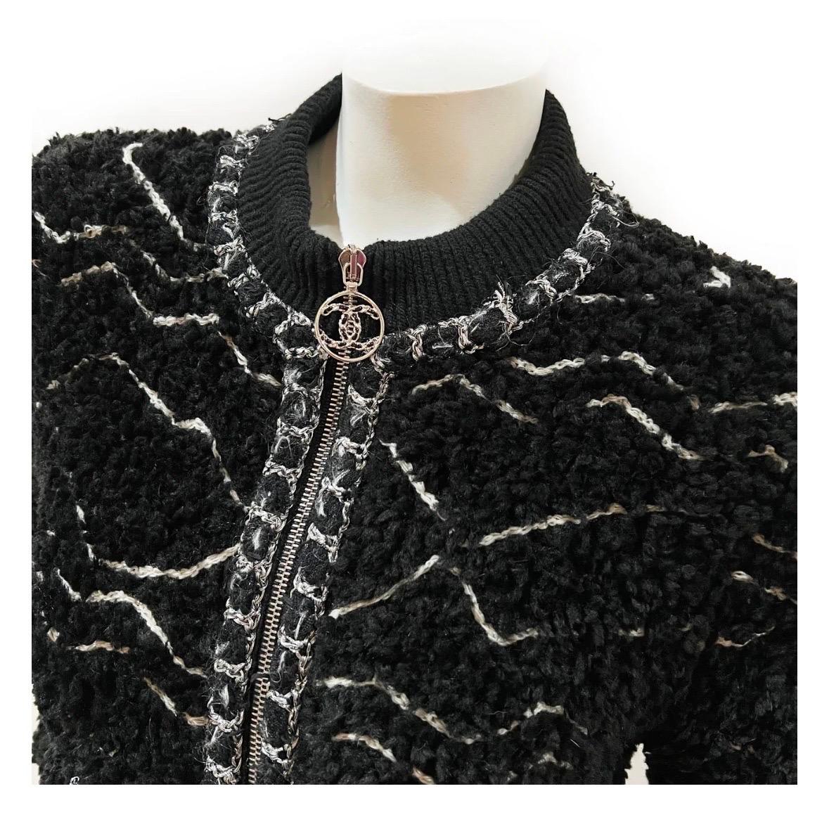 Black Fuzzy Alpaca Zip Designer Jacket by Chanel
Fall / Winter 2019
Made in Italy
Black/white
Silver and black tweed trim
Fuzzy Alpaca texture detail throughout jacket
Ribbed collar and bottom detail
Silvertone hardware
Front zip closure 
Dual open