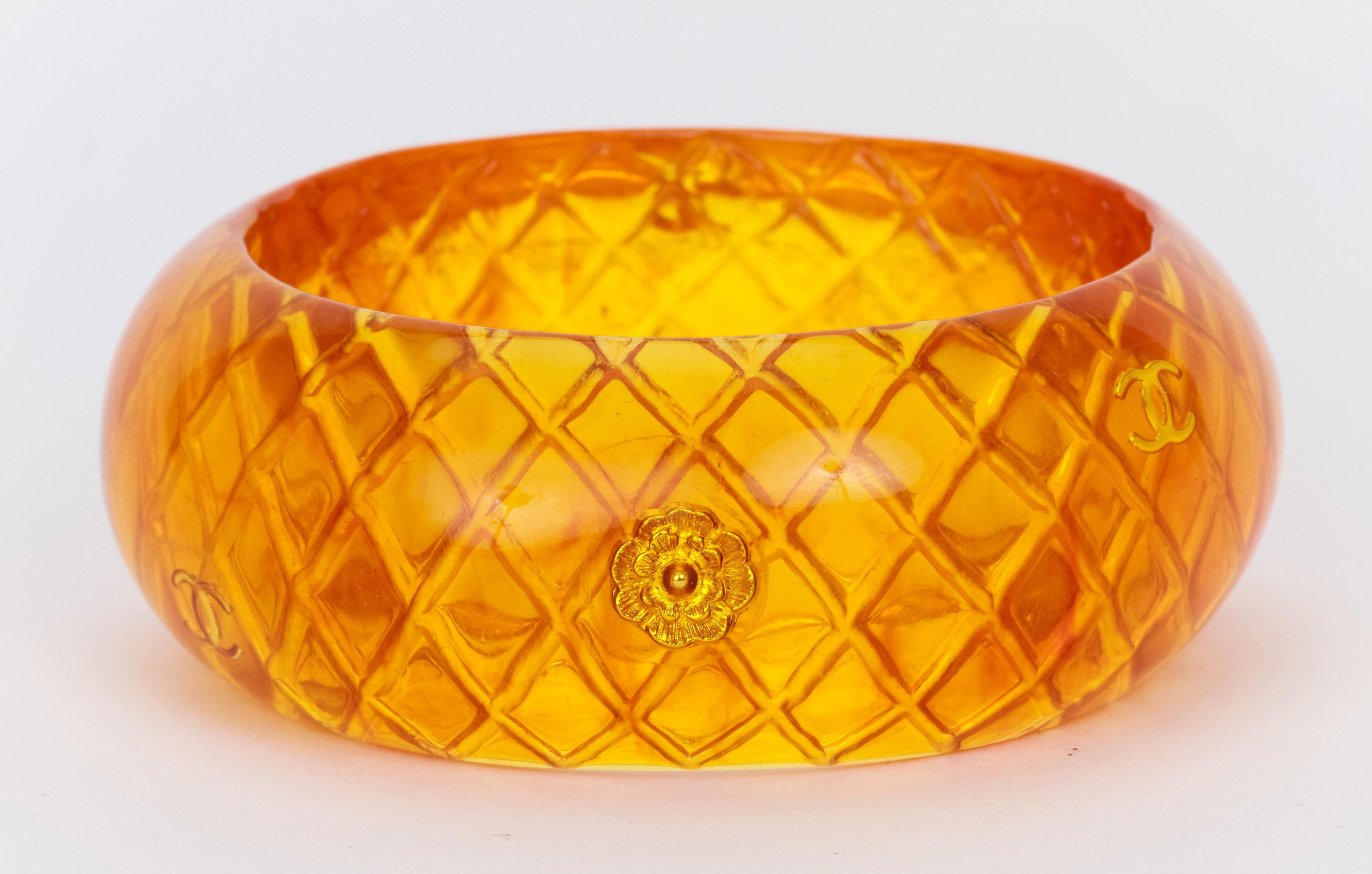 Chanel amber quilted bangle bracelet with inlay CC logos, camellia flowers, and even a lucky turtle. inside diam 2.5
