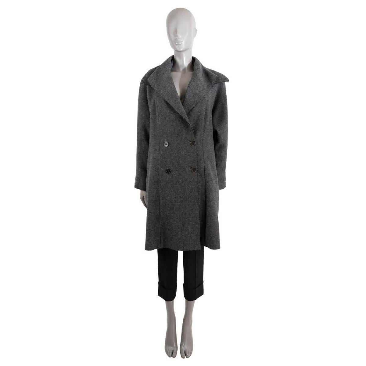 100% authentic Chanel double breasted coat in anthracite grey wool (100%). The design features a wide collar, slit pockets on the side, open hem details and a slightly flared silhouette. Lined in anthracite silk (100%). Has been worn and is in