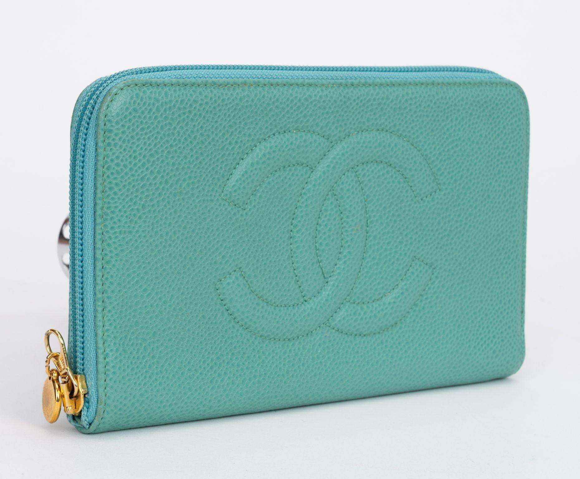 Chanel preloved aqua caviar leather large zip around wallet. Gold tone hardware. Collection 5. Comes with hologram and original box.
