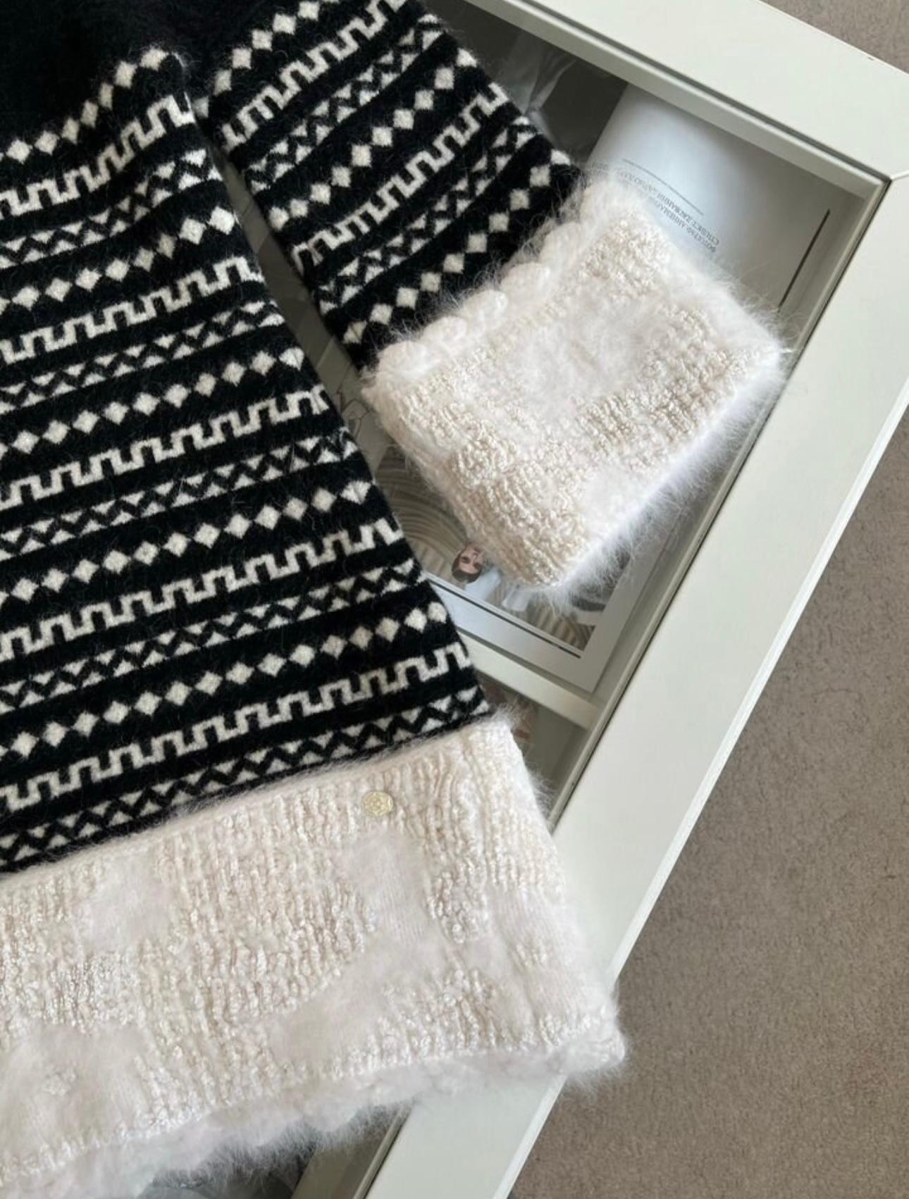 Chanel black and white knit dress with fluffy angora accents from ARCTIC ICE Collection.
- CC logo charm at side
Size mark 36 FR. Pristine condition.