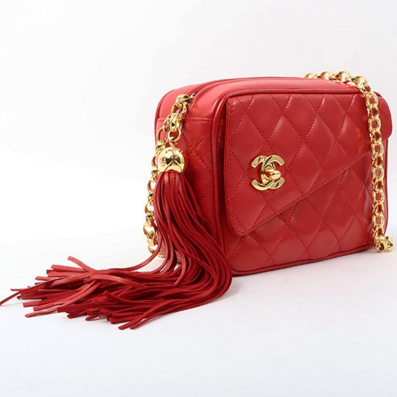 Chanel Around 1992 Made Turn-Lock Fringe Bijoux Chain Bag Red

Additional information:
Interior pocket x2, exterior pocket x1
Comes with: Guarantee card, Serial number sticker
Accessories:???Box
Year: 1992
Made in Italy ADDACODE.
Size: 18 W x 7 D x
