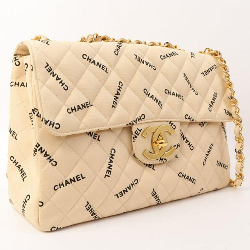 Chanel Around 1995 Made Canvas Logo Print Classic Flap Chain Bag Maxi Beige

Additional information:
Interior pocket x2, exterior pocket x1
Comes with: Serial number sticker No Guarantee card
Accessories: Box, Dust bag
Year: 1995
Made in