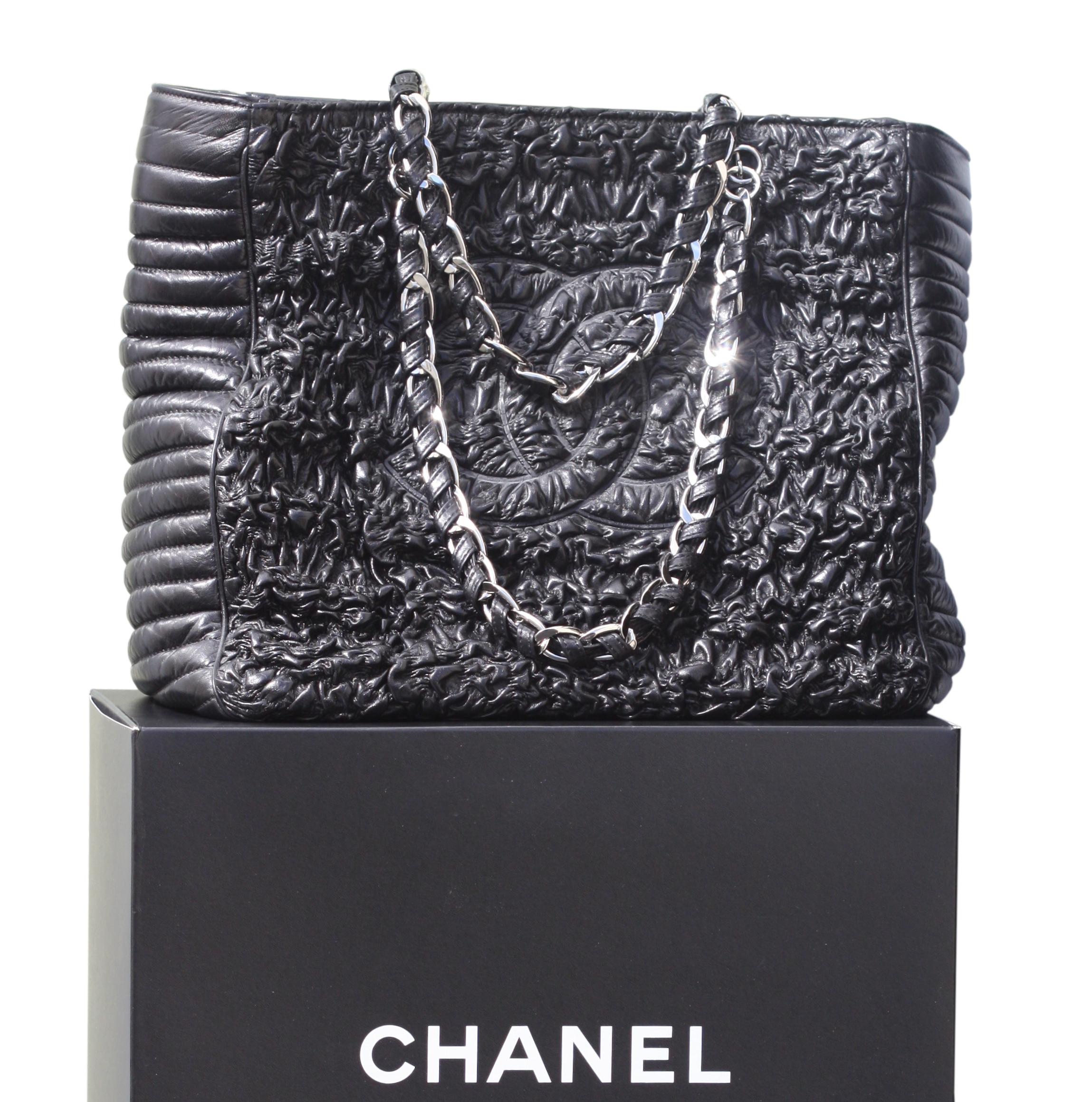 
Chanel Astrakhan Black Leather Ruched Shopping Tote, Limited Edition
Leather ruched astrakhan front and back with CC quilted along both sides
Striped quilted pattern along sides and base
Top double leather wrapped and woven chain handles
Top zip