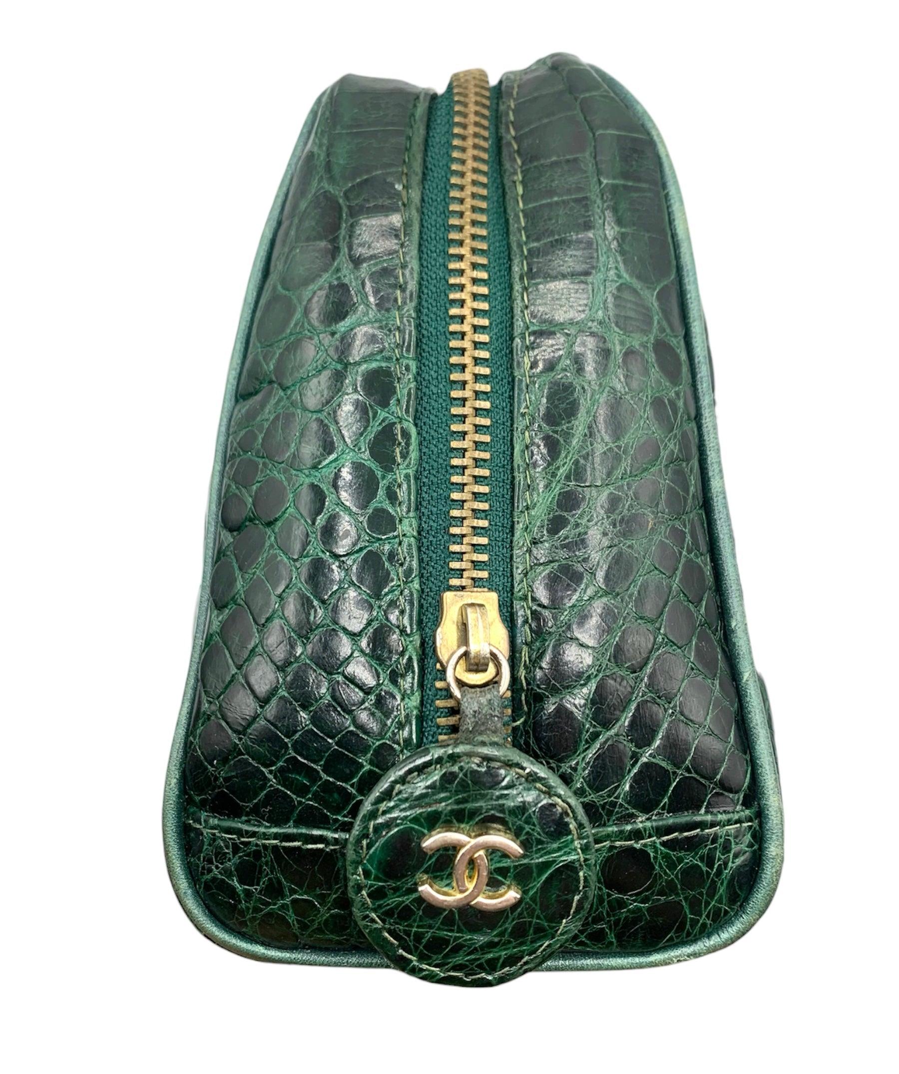 This Chanel Green Crocodile Camera Handbag is a rare and very special addition to any collection. Crocodile skin in a rich, deep emerald color. zip top closure and double handles for added convenience. With double inside zipper pockets. this a was a