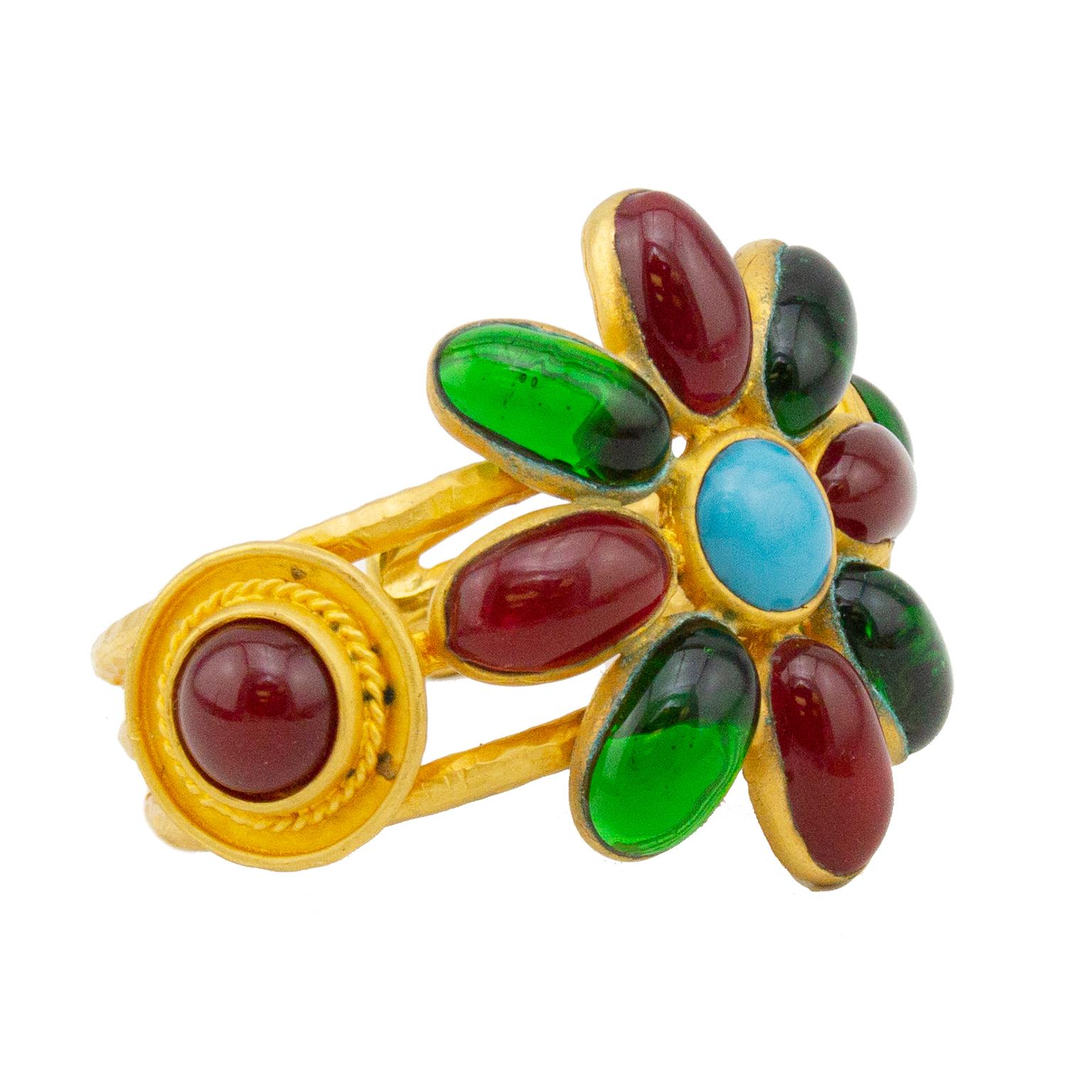 Stunning Autumn 1993 Chanel cuff. Gold tone metal with large flower in the centre. Flower features a turquoise stone centre with red and green poured glass petals. Two medallions on either side of the flower featuring matching red poured glass