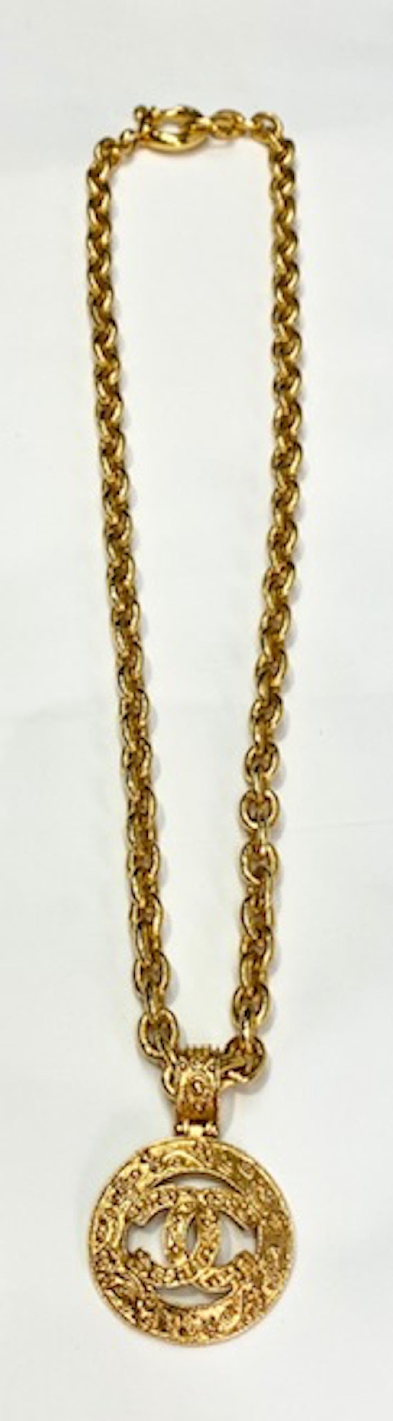 A very nice and Chanel pendant necklace from the Autumn 1994 collection. The chain is a heavy 3/8 of an inch wide anchor link and measures 26.5 inches long including the clasps. One end has a large 7/8 of an inch jump ring with interlocking CC logo
