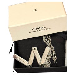 Chanel Autumn Winter 2026 measuring rule pendant necklace invitation by Blazy