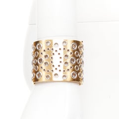 CHANEL B16 gold tone silver CC logo punctured grommet eyelet cuff bangle
